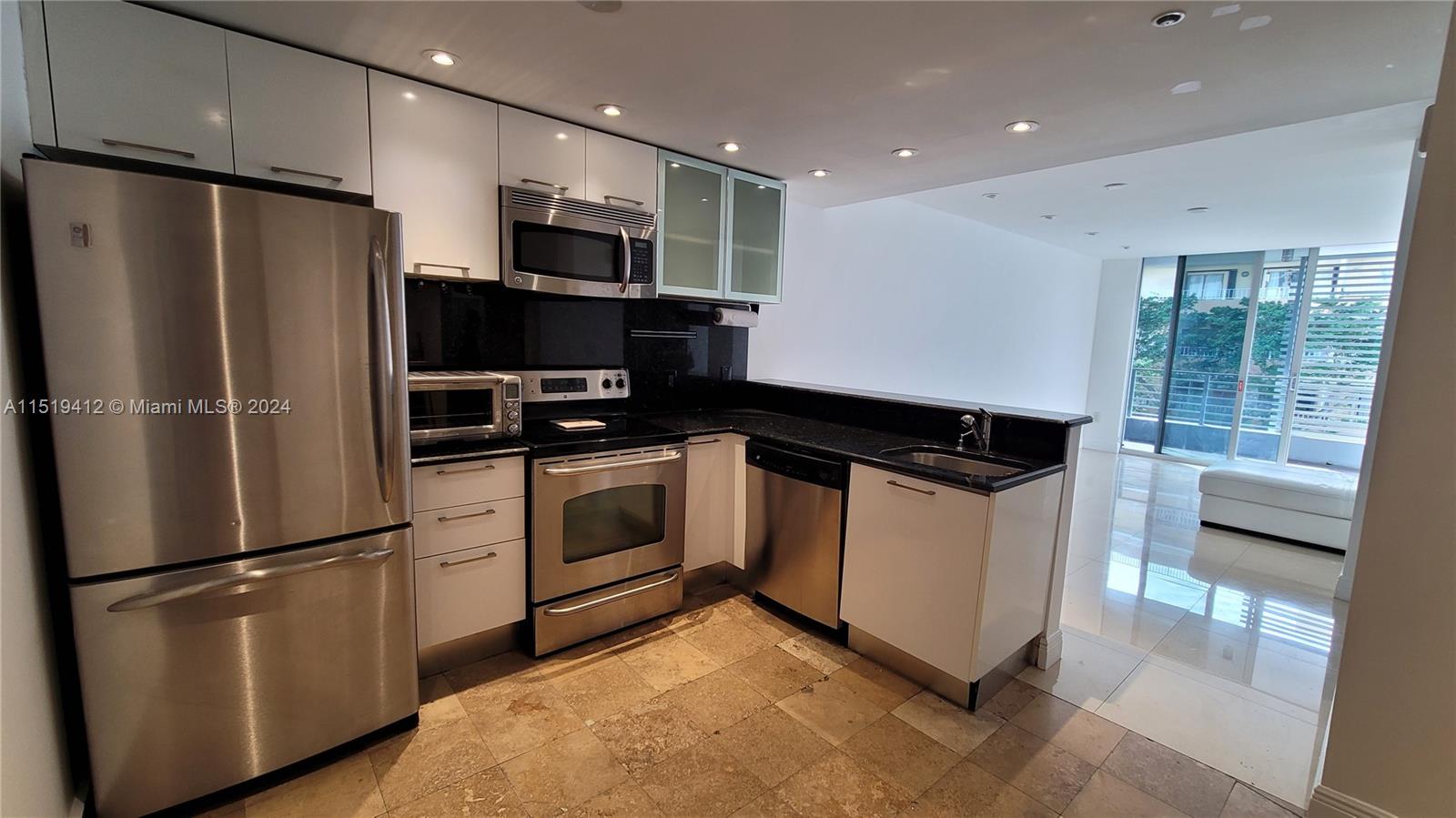 Conveniently located steps from Coco Walk, close to Regatta and Peacock Parks and top-notch shops and restaurants, this lovely Penthouse Unit offers the comfort of 1 Bedroom and One full bath, with marble and porcelain tiles, Washer and Dryer inside of the Unit, Balcony and interior stairs to a private roof Top.
The modern Kitchen features stainless Steel Appliances and a dark granite countertop.
Amenities includes Pool, Gym and Sauna.
One parking space assigned.
There are 2 Pickleball Courts across the street free to play, you have to bring your own net.