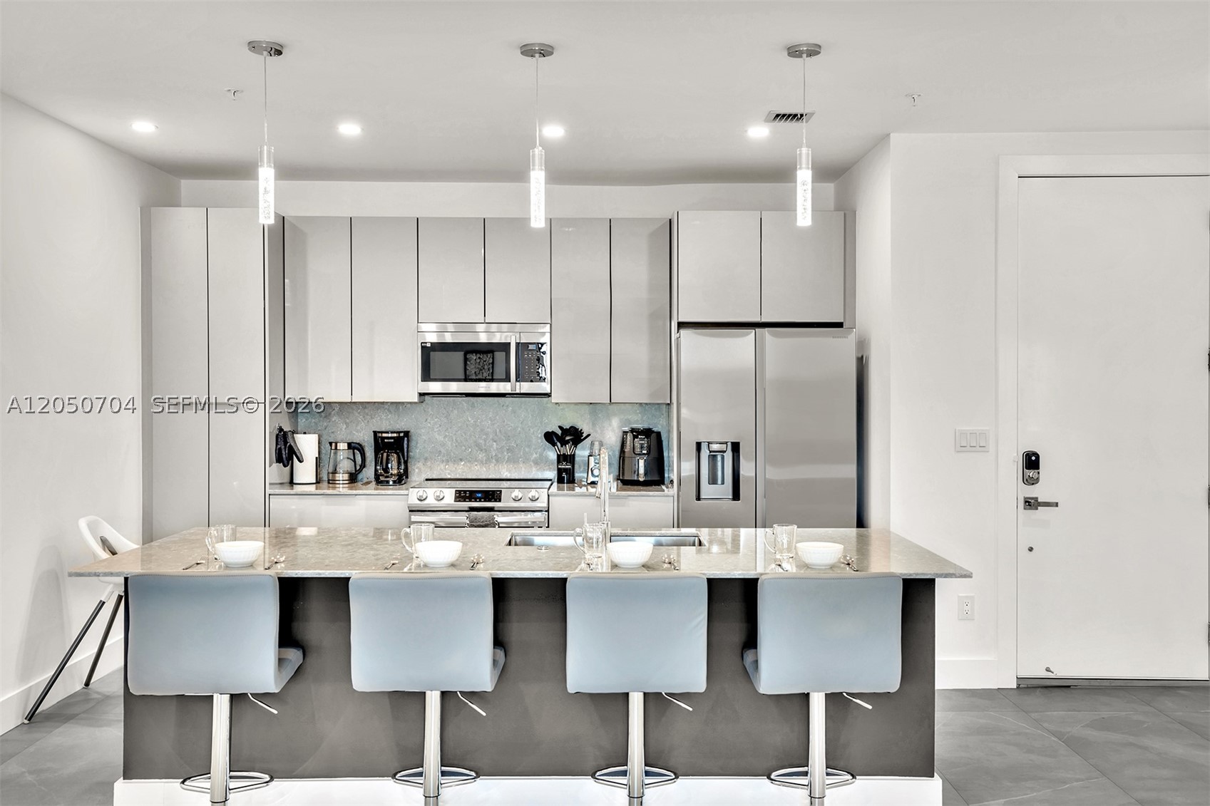 Enjoy modern living in this exceptional 3-bedroom, 3-bathroom residence that perfectly blends style, comfort, and convenience. Thoughtfully designed with quality craftsmanship, generous living spaces, and modern comfort in mind, this beautiful home offers soaring ceilings, abundant natural light, and large private balconies that create an open and inviting atmosphere. The well-planned layout includes two spacious master suites, a stylish bar area with a wine refrigerator, and a full-size washer and dryer for added convenience. Residents enjoy access to a fully equipped fitness center, elevator service, one assigned parking space plus guest parking, and a spectacular rooftop terrace featuring panoramic views and a BBQ area. Ideally situated just minutes from Las Olas, Fort Lauderdale Beach, Port Everglades Cruise Port, Fort Lauderdale-Hollywood International Airport (FLL), premier shopping, dining, and entertainment. Rent includes internet, water, sewer, trash, and pest control. Fully furnished. 
Available for move-in August 1, 2026.