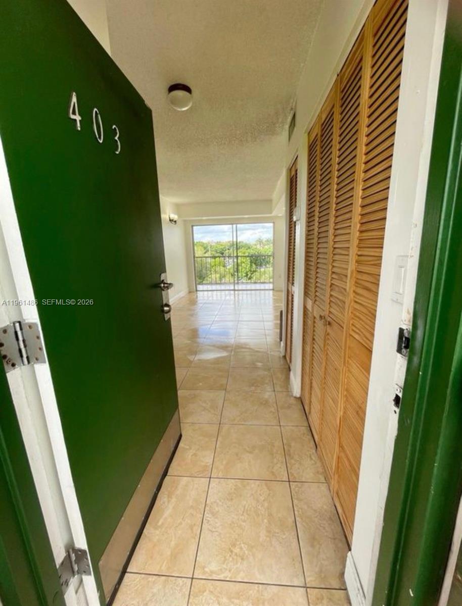 Spacious and sun-filled 1-bedroom, 1-bath condo with balcony at Castillian Club. Centrally located near FIU, major highways, Miami International Airport, and shopping. The community offers a pool, tennis court, elevator, and low HOA fees. Investor-friendly building with no rental restrictions.