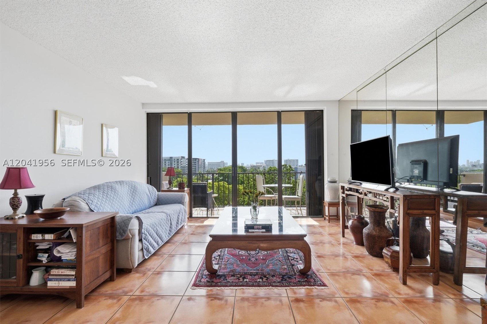 Wake up to lovely east-facing skyline views from this bright and inviting 2-bedroom, 2-bath residence. The desirable eastern exposure helps keep the unit naturally cooler throughout the day while filling the space with beautiful morning light.

Designed with privacy in mind, the split-bedroom floor plan features two spacious en-suite bedrooms, each with its own bathroom and generous walk-in closet. Tile flooring throughout provides a clean, modern look and easy maintenance.  Updated kitchen with newer appliances. Storm shutter for peace of mind.  Air ducts have been professionally cleaned.

Enjoy resort-style amenities in this gated community, including a swimming pool, fitness center, jacuzzi, dog park, BBQ area, and abundant guest parking. The unit also comes with two assigned parking spaces—one covered in the garage and one above ground, and guest parking.

Location is everything, and this home delivers. Just one block from Biscayne Boulevard, you'll be moments from Whole Foods, LA Fitness, popular restaurants, shopping, and everyday conveniences, while the beach is less than two miles away.

Whether you're searching for your next home or a smart income-producing asset, this property checks all the boxes. With immediate rental eligibility, it offers exceptional flexibility and strong investment potential in a highly desirable location.