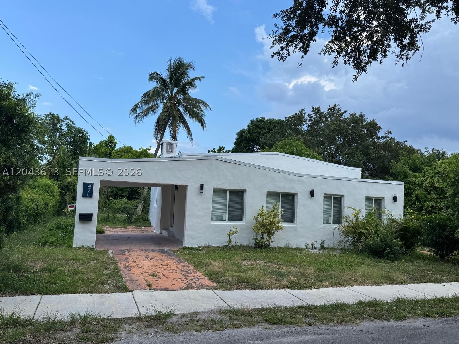 Spacious 3-bedroom, 2-bathroom residence located on a quiet U-shaped street, providing enhanced privacy and minimal through traffic. The layout offers excellent potential to convert the primary suite into an independent efficiency/in-law suite with a separate private entrance, with a walk-in closet and a private in-suite bathroom.
Features a large landscaped green area in front of the property, creating an open setting with excellent privacy and abundant guest parking and includes a spacious private backyard, ideal for outdoor living, entertaining, gardening, or future improvements.

IMPROVEMENTS & RENOVATIONS: 
 NEW PVC sanitary sewer system, replaced all water supply piping throughout the property / NEW electrical system upgrade, including wiring, exterior service entrance, and electrical panel / NEW water heater and AC system, including equipment, ductwork, and components / NEW flooring throughout the entire home / NEW roof and interior ceilings / NEW impact-resistant windows and exterior doors / RENOVATED bathrooms / RENOVATED 
kitchen with new cabinetry, countertops, and appliances / NEW interior drywall, textures, and finishes throughout the home / NEW lighting fixtures throughout the property.
