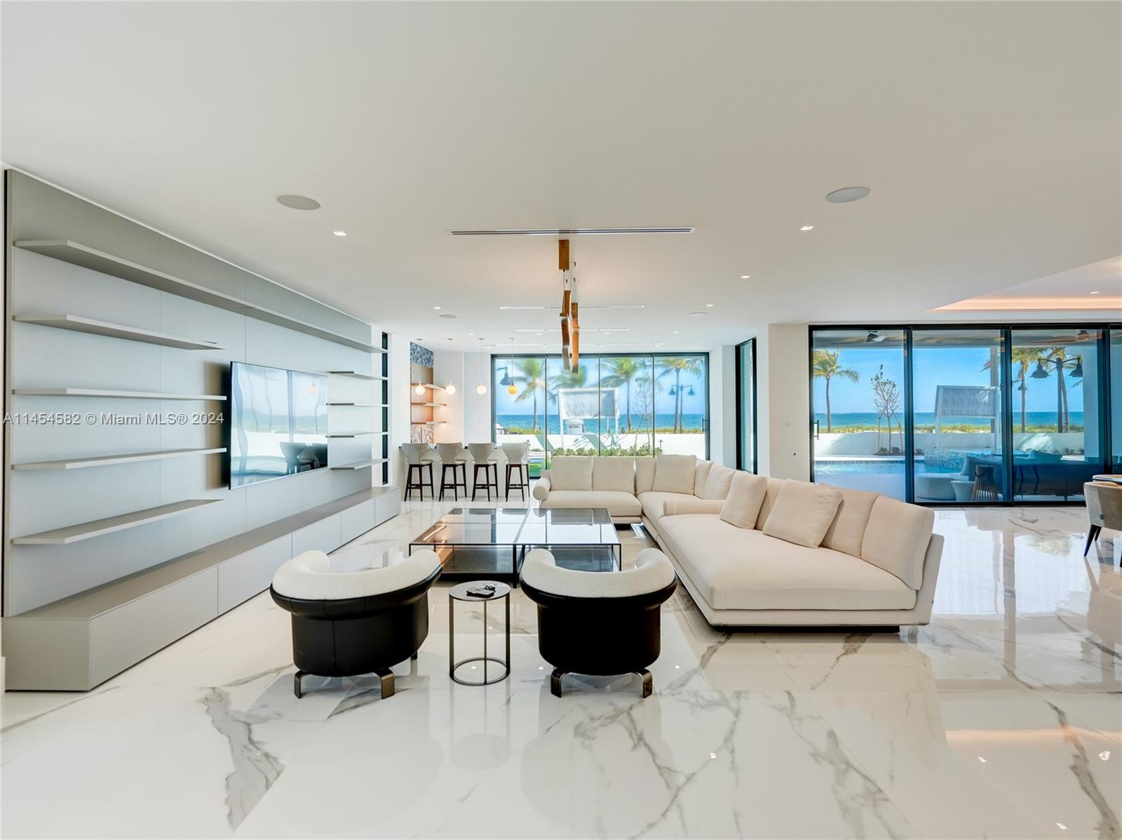 Direct unobstructed ocean views just steps from the sand.Luxurious  6-bedroom, 8-full bath, and 2-half bath beachfront residence, complete with a gym and sauna, featuring exquisite craftsmanship and high-end finishes throughout. Italian porcelain graces the floors, with two distinct kitchen spaces. Enjoy the main kitchen which boasts elegant Aqua Quartzite countertops, and a chef's kitchen, perfect for entertaining. Additional highlights include a 4-car garage, Boffi vanities, and top-tier brands like B&B Italia, Maxalto, and Roche Bobois. Enjoy Euro wall sliders on each floor, a custom wine cellar, a Lutron smart home system, and a theater room with a 100-inch drop-down projector screen. Trimless lighting and Henge fixtures add to the modern elegance.