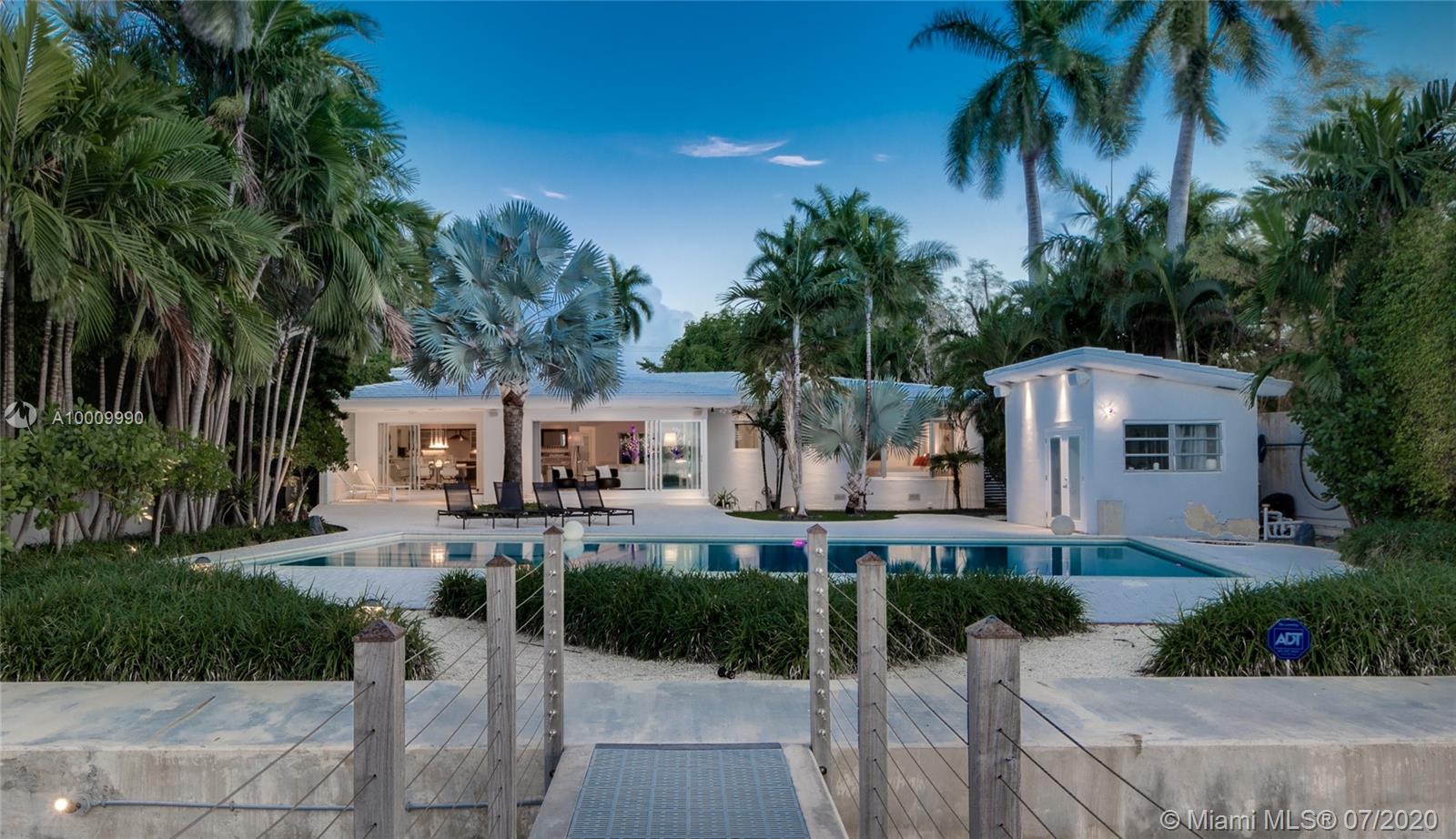 LAND VALUE! The lowest priced waterfront on prestigious North Bay Road! Situated on a 19,685-SF lot with 75 feet of wide waterfrontage on the most prestigious Miami Beach address, this lushly landscaped waterfront property is completely secluded with high hedges for extra privacy and security. The current house is a fabulously modernized mid-century modern featuring an open-concept floor plan with floor-to-ceiling impact doors and windows, terrazzo floors, updated kitchen with a wet bar, large master suite, new roof, and more. The expansive backyard features a pool and offers incredible water and sunset views! The property has a new seawall and dock.