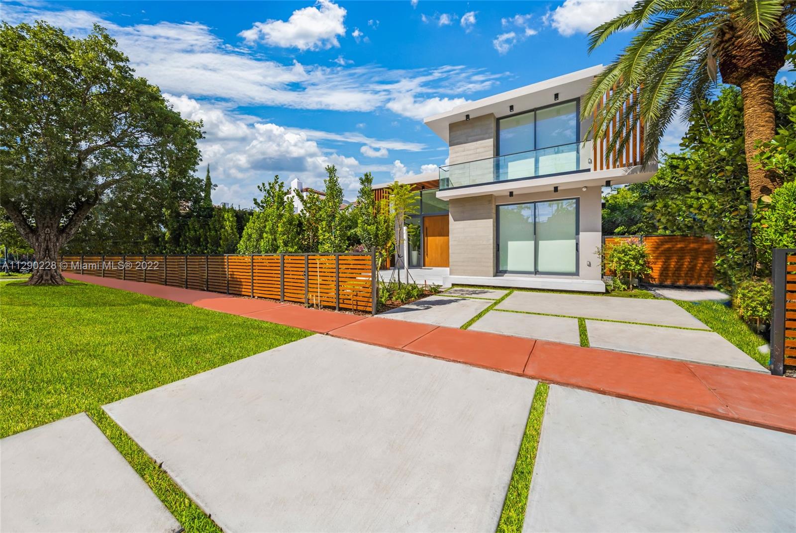 Just Finished & Ready to move in! Brand new modern masterpiece located on the exclusive Pine tree Dr. Stunning 4 bedrooms home designed by award winning architect Ralph Choeff. This 3677 SF home is situated on an 7567 SF lot with gated entry, private pool surrounded by lush tropical landscape. This residence has been designed to perfection featuring sleek interior finishes throughout, a large open floor plan and functional indoor-outdoor living.