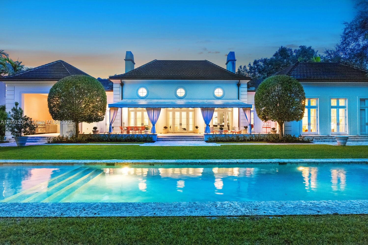 Welcome to the art of modern South Florida living. From the grand entrance to the museum-quality backyard landscape, live in a home that's a true work of art. Custom built in 2011 in the French Provincial style, this private one-story home features light-filled spaces with 18- and 14-foot ceilings, wood floors, picture perfect windows & bespoke finishes throughout. It features 6 BR/6.5 BAs on a 44,239 sq ft lot with manicured gardens designed by renowned Palm Beach landscape architect Mario Nievera. The Hamptons-inspired oasis includes a 1,000-square-foot covered terrace, outdoor kitchen with built-in grill, and heated & cooled saline swimming pool. Even Mr. David Fairchild would feel at home surrounded by all this nature. In the middle of everything, yet miles away from the ordinary.