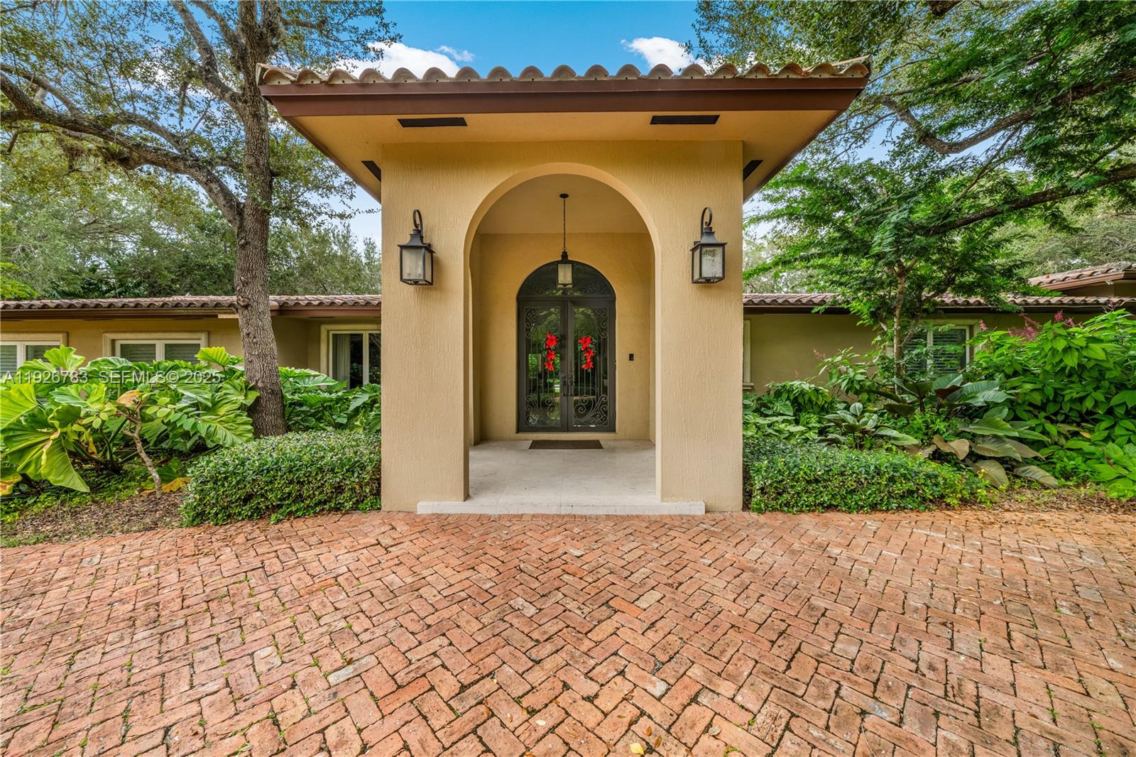 This North Pinecrest Gem has been tastefully updated and is beautifully positioned on this spectacular, oak studded lot! Enter through wrought iron gates to a Chicago brick circular driveway. Gracious entry way flows into an open floor plan, a magnificent kitchen with walnut cabinetry and top of the line appliances. The deep covered terrace is perfect for entertaining, overlooking a spectacular heated pool. The primary suite features 2 walk in closets and sumptuous bathroom which also opens onto pool. There is a spacious room which could be used as a 6th bedroom or office.
So much space on either side of this gracious home to expand if desired.
Bring your most discerning Clients!