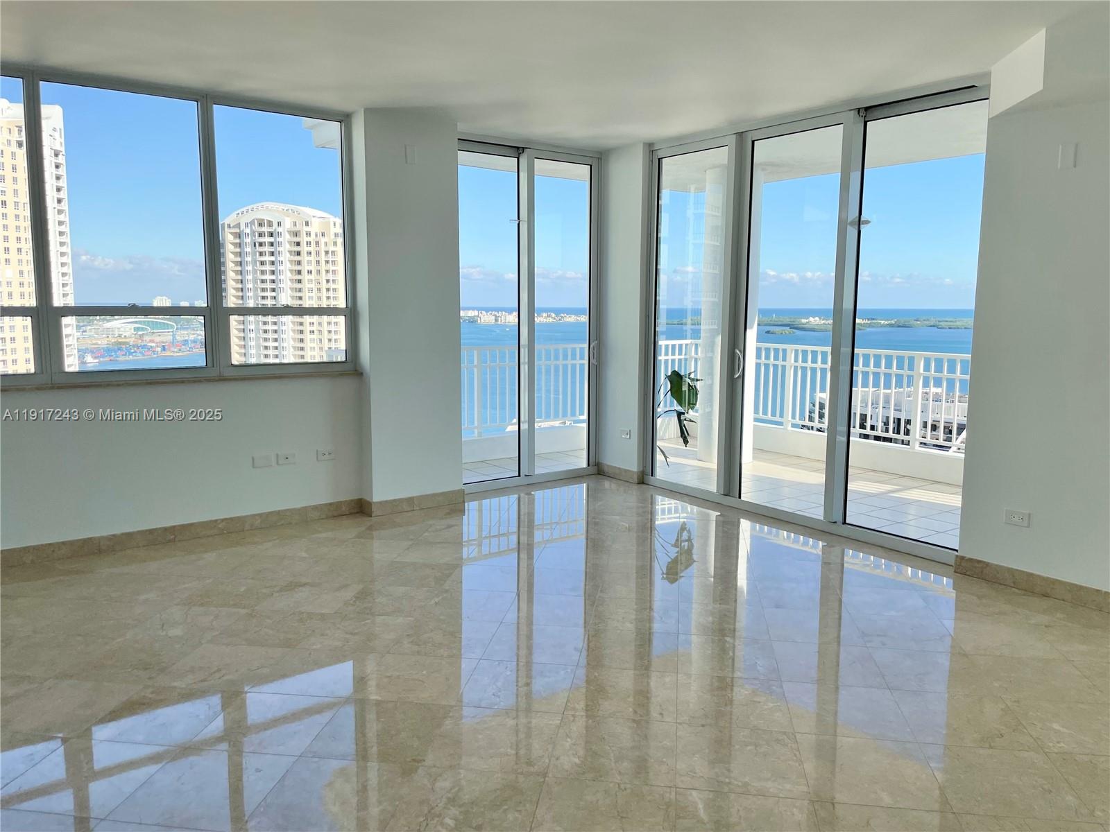Lower penthouse residence with high ceilings. This 2-bedroom, 2.5-bath corner unit offers unobstructed views of the ocean, bay, and city skyline. Floor-to-ceiling windows fill the space with abundant natural light, and expansive balconies provide the perfect indoor-outdoor living experience. Includes two assigned parking spaces (tandem) and a separate assigned storage unit, all included in the purchase price. Easy to show and ready for immediate occupancy.
