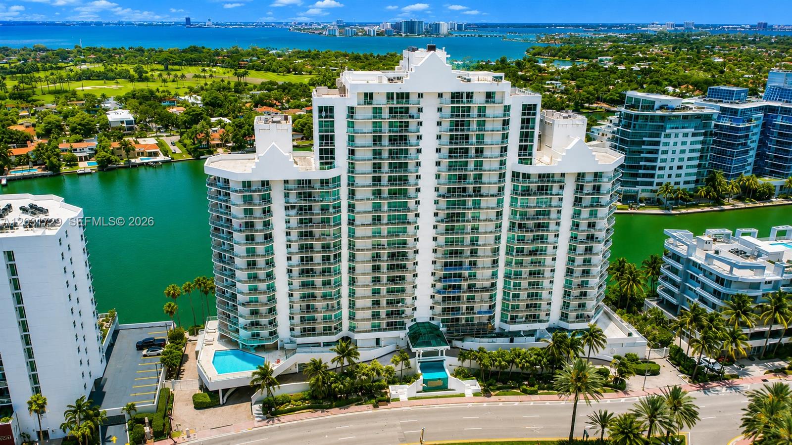 Luxurious waterfront residence on prestigious Millionaire's Row featuring breathtaking panoramic views of the Atlantic Ocean, Intracoastal Waterway, and Miami skyline from every room. This spacious 3BR/2BA condo offers floor-to-ceiling windows, abundant natural light, a private elevator foyer, and an expansive wraparound balcony perfect for enjoying spectacular sunrises and sunsets. Residents enjoy 24-hour security, secured entry, concierge services, and valet parking for added convenience and peace of mind. Includes assigned covered parking plus guest parking. Resort-style amenities include a heated waterfront pool, spa, fitness center, sauna, club room, marina, rooftop sun deck, bike and kayak storage, and easy beach access just steps away. Some photos may be virtually staged.