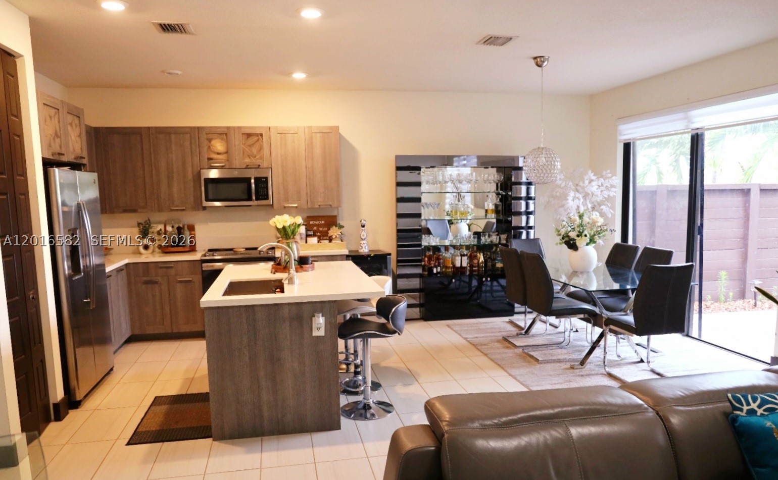 Beautiful townhouse located in the prestigious gated community of Satori in Miami Lakes. This modern residence offers spacious living areas, contemporary finishes, and access to resort-style amenities including clubhouse, pool, fitness center, playground, walking paths, and scenic lake views. Conveniently located near major highways including 1-75, Palmetto Expressway, and Florida's Turnpike, with easy access to shopping centers, restaurants, and top-rated schools.
