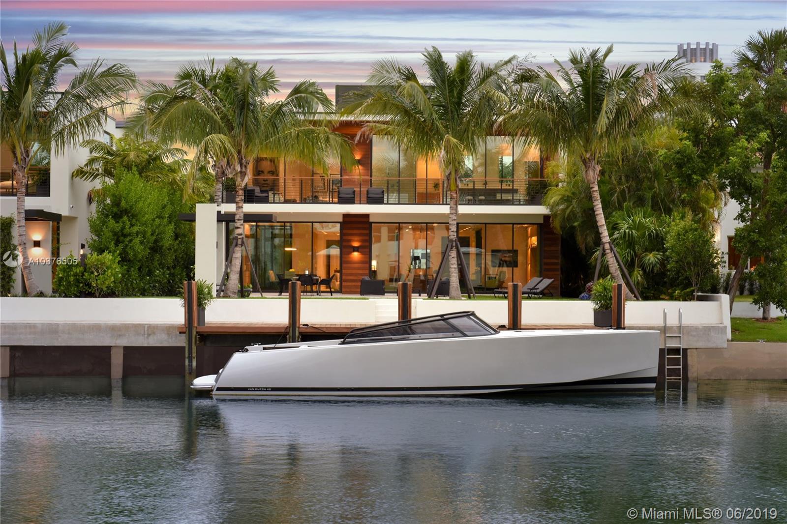 Extravagant 6 bedroom/6.5 bath Contemporary Residence by Choeff, Levy, Fischman architecture firm. Built by Massa Construction Group and designed by Dunagan Diverio Design Group. Seamless indoor/outdoor living open floor plan. 180 degree waterfront views, gorgeous outdoor area and Kitchen, large pool. Elegant features include European oak and Capri natural stone floors, Wolf & SubZero appliances, designer Apure lighting, and fully intregrated Lutron control system.
