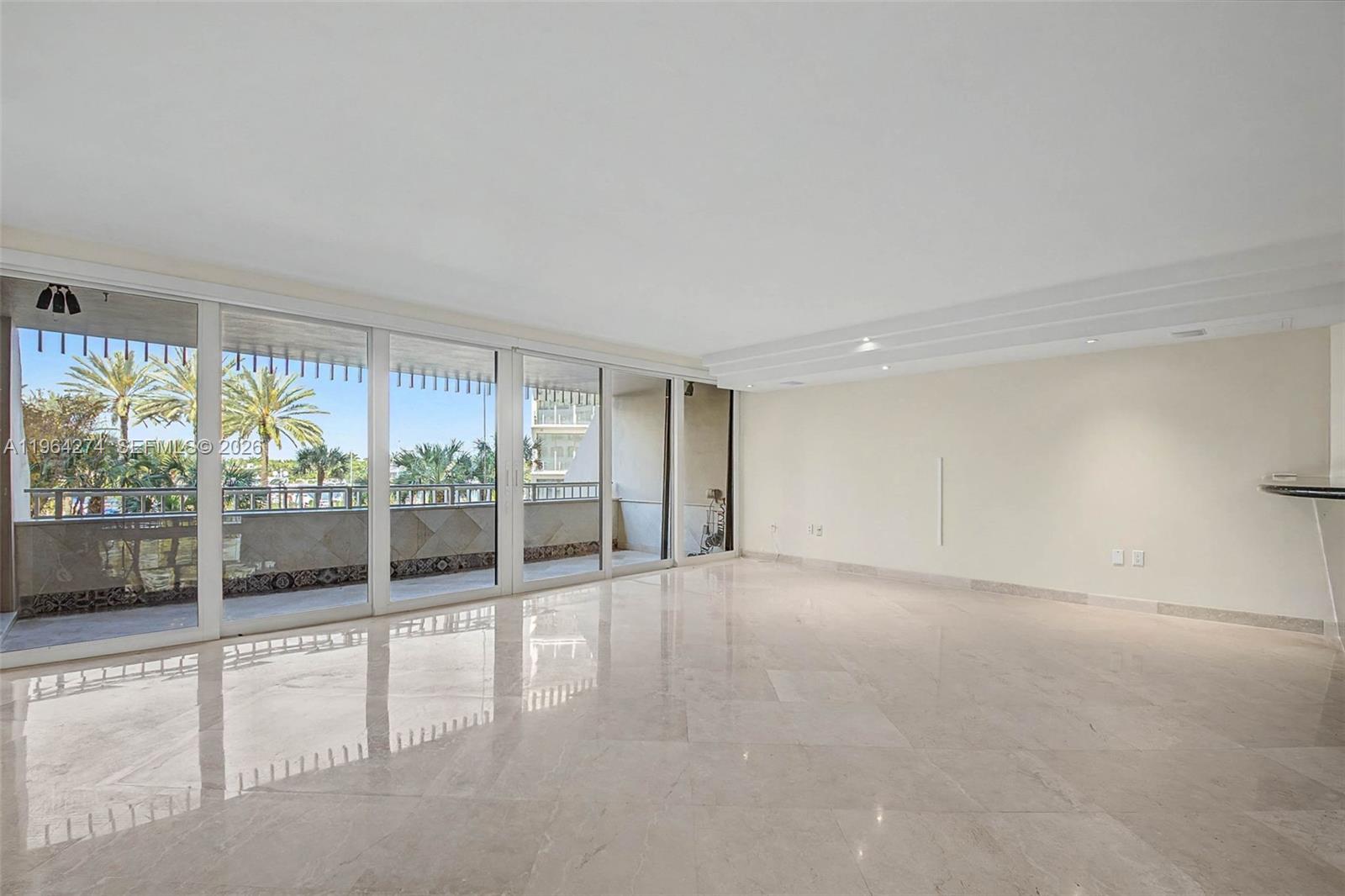 Wonderful 2 bdrm/ 2 bath condo in the unique & special, waterfront community of Grove Isle in Coconut Grove. Old world charm & sophistication welcome you as you pull up to the valet attended entrance. Beautiful, ornate common areas w/ full-time concierge, pool, & tennis cts. This lovely condo has a spacious, open living area w/ dining rm. Custom kitchen feat. stainless appliances, granite countertops, wood cabinetry, eat-in bar. Split bdrm plan w/ private primary suite & large bath w/ soaking tub, shower, dual sinks, walk-in closet. 2nd bdrm could also be used as a den or office. Lovely balcony w/ views of the marina. Residents will have full enjoyment of the luxury amenities at Vita at Grove Isle,  including a spa, fitness center & more, scheduled for completion in early 2026. 2 parking spaces.