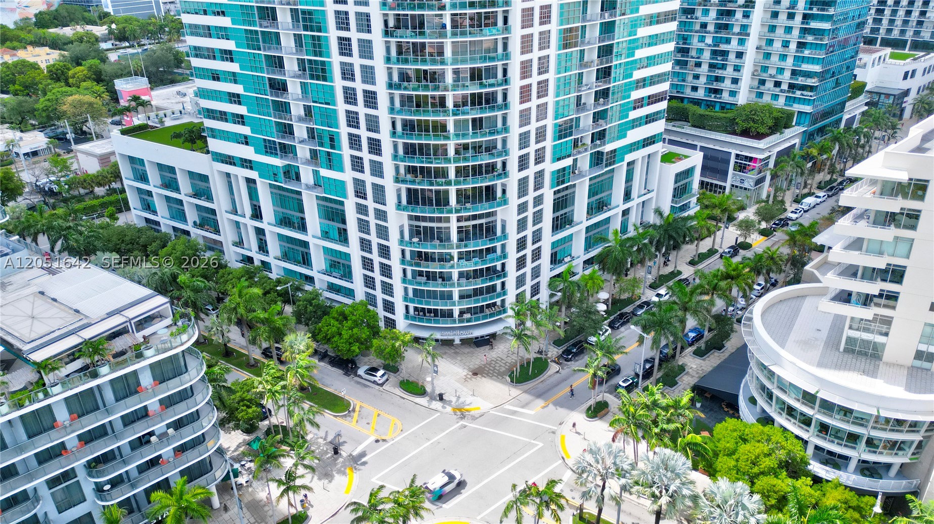 Experience elevated living in this beautifully updated 2-bedroom, 2-bath residence at Four Midtown Miami. Located on the 23rd floor, this light-filled home offers impressive bay, city and skyline views through floor-to-ceiling impact glass and an oversized private balcony. The open-concept floor plan features upgraded wood flooring throughout, exposed concrete ceilings, a spacious kitchen with quartz countertops, stainless steel appliances, generous cabinetry, and a large island ideal for everyday living and entertaining. The split-bedroom layout provides privacy, spacious closets, and a full-size washer and dryer. Four Midtown offers exceptional amenities including a resort-style pool deck, hot tub, sauna, steam room, fitness center, concierge, 24-hour attended lobby, and covered parking. Located in Midtown Miami with convenient access to the Design District, Wynwood, Edgewater, Downtown Miami, shopping, dining, entertainment, and major highways. Excellent opportunity as a primary residence, second home, or investment property. Pet friendly.