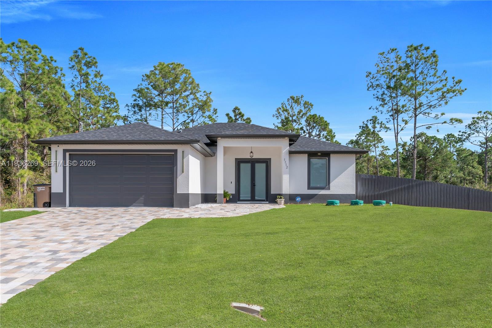 Discover modern elegance and peaceful living on a spacious half-acre lot.  Home is move in ready, no HOA, everything new & features a whole home AquaClean water purification system throughout & Dura Fence all around property.  This beautifully designed 3-bedroom, 2-bathroom home offers the privacy, space, and flexibility today’s buyers are looking for perfect for storing a boat or RV, adding a pool, or hosting memorable family gatherings.

Inside, the open-concept layout is anchored by a sleek, contemporary kitchen featuring crisp white cabinetry, quartz countertops, and modern silver fixtures. The spa-inspired bathrooms impress with LED mirrors equipped with dimming and anti-fog technology, while the primary suite elevates comfort with dual shower heads. Custom closets in every bedroom provide tailored storage solutions throughout the home.

Unwind on the screened lanai or enjoy the convenience of nearby shopping, schools, and medical facilities—all while coming home to a serene, private setting. This exceptional property blends style, comfort, and location.
