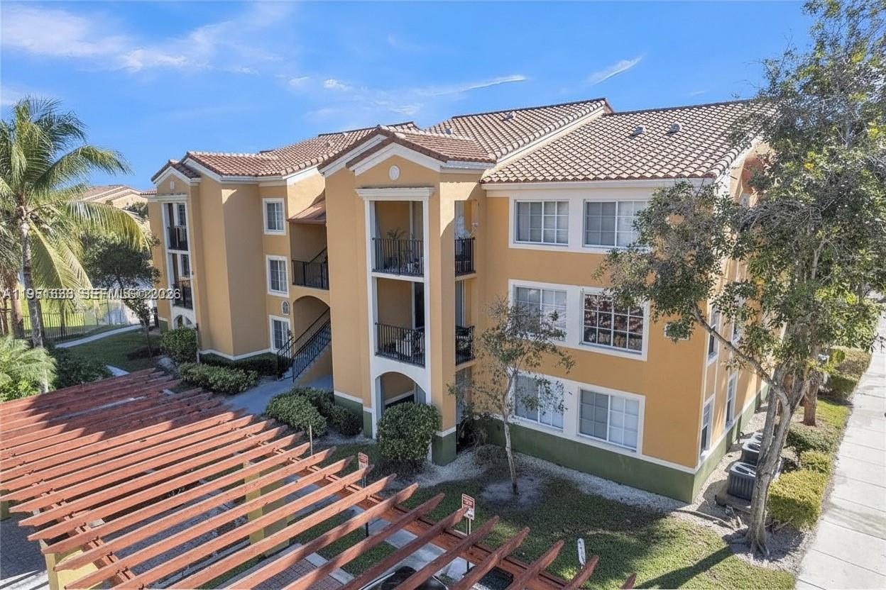 Beautifully maintained first-floor 3 bedroom, 2 bathroom condo offering 1,132 square feet of comfortable living space with tranquil lake views and convenient ground-level access. Tile flooring throughout, a bright open layout filled with natural light, stainless steel appliances, granite countertops, and a full-size washer and dryer in unit. Spacious living and dining areas flow seamlessly for everyday living and entertaining, while the split-bedroom layout provides privacy and comfort. Ideally positioned next to the clubhouse for added convenience. Community amenities include a pool, clubhouse, fitness center, racquetball court, and tennis courts. Centrally located in Miramar near shopping, dining, major highways, the Florida Turnpike, and I-75. Move-in ready and easy to show.