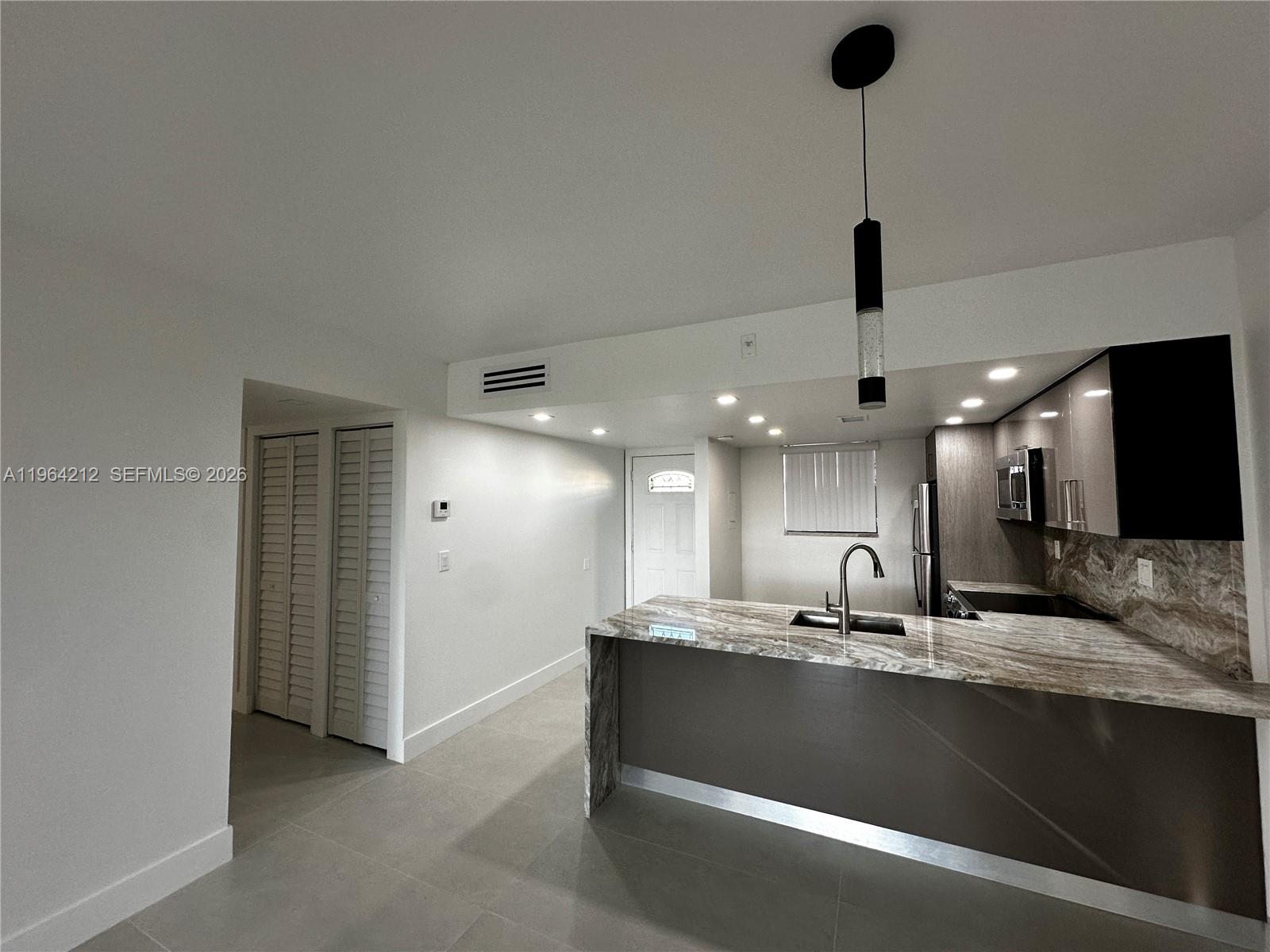 Be the first to live in this completely remodeled 2-bedroom, 2-bathroom unit offering modern finishes and a bright, open layout. This home features a brand-new kitchen with updated cabinetry, sleek countertops, and stainless-steel appliances. Both bathrooms have been fully renovated with stylish finishes. Perfectly located within walking distance to Miami Dade College and just down the street from the 874 Highway, providing quick and easy access to major roads, shopping, dining, and entertainment.