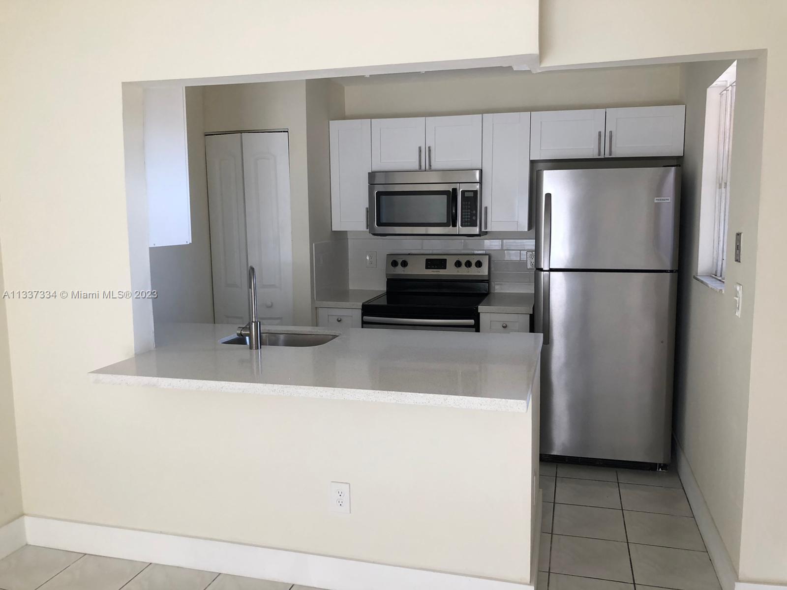 Fully remodeled 3/2 in Lago Grande Condominium. Remodeled kitchen with white cabinets, quartz counter tops, stainless steel appliances. Plenty of storage space. New pvc floors in bedrooms, tile floors in the rest of the property. New bathroom vanities. Washer and dryer in unit. Balcony.
