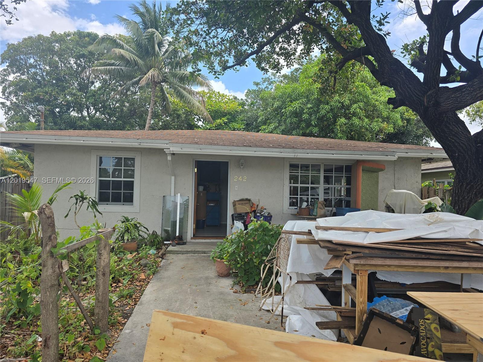 Charming Dania Beach home with great potential! This property offers a spacious backyard perfect for entertaining, gardening, or future outdoor additions.  A beautiful mature tree in the front yard provides abundant shade and helps keep the home cool year-round. Home is in need of a little TLC, making it a great opportunity for investors, first-time buyers, or anyone looking to add their personal touch.  Conveniently located near major highways, shopping, dining, beaches, and entertainment. Less than five minutes from Dania Pointe and the Ft. Lauderdale/Hollywood Airport