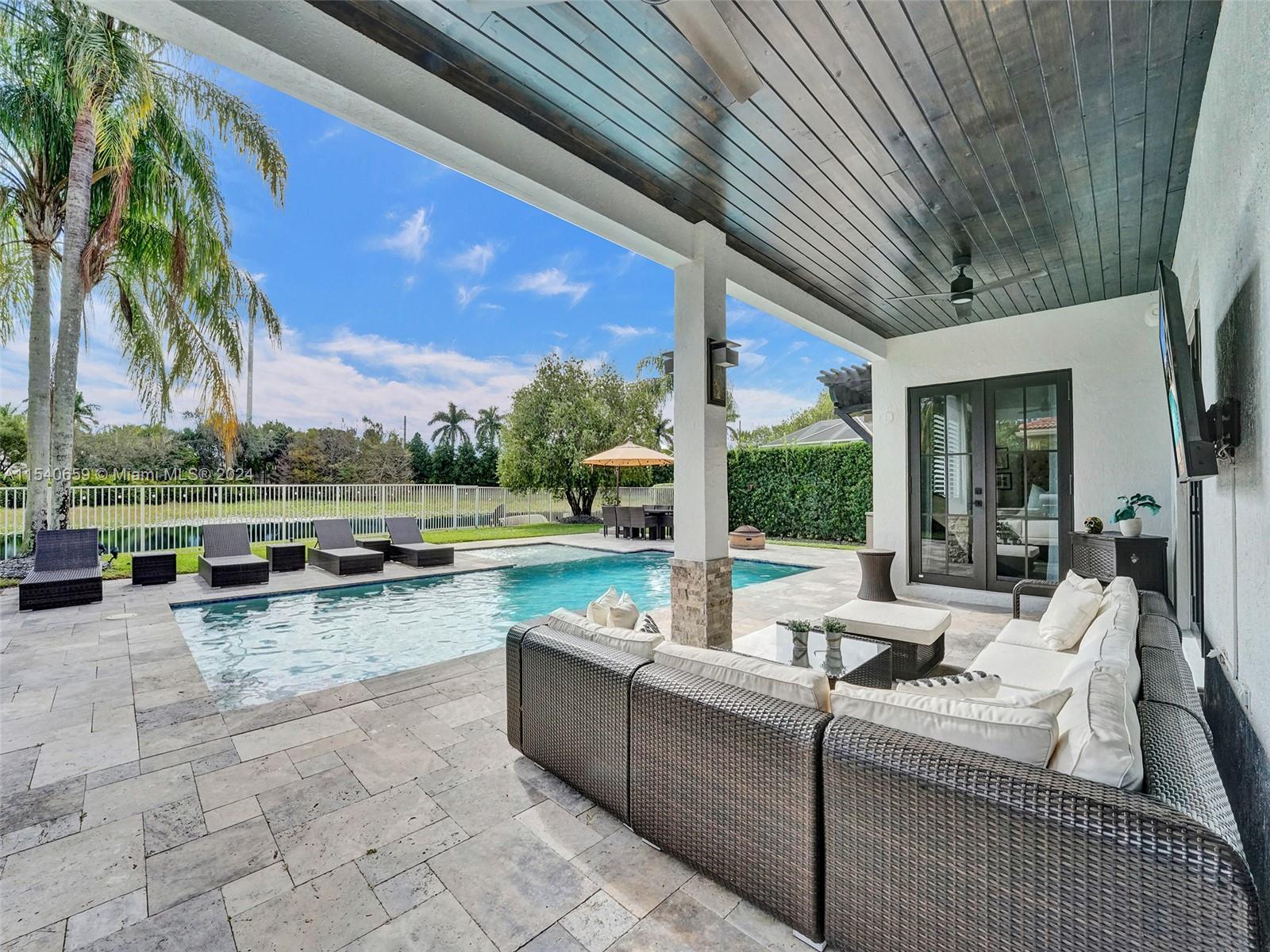 Welcome to your dream residence where luxury meets comfort in every square inch of this meticulously upgraded home with no detail spared. Located in the coveted city of Weston, in the gated community of Savanna offering 5-star resort amenities designed to enhance your quality of life. Home features impact windows & doors, newer roof, new AC, remodeled bathrooms, & much more. The open kitchen is a chef's delight featuring white cabinets with S/S appliances, & a spacious granite counter. The backyard is a tropical oasis, ideal for relaxation & outdoor activities. Travertine tiled patio, custom pool featuring salt water system, heater & separate sun shelf overlooking serene water views with no neighbors in the back for optimal privacy & feeling like you’re on vacation every day. Won't Last!!