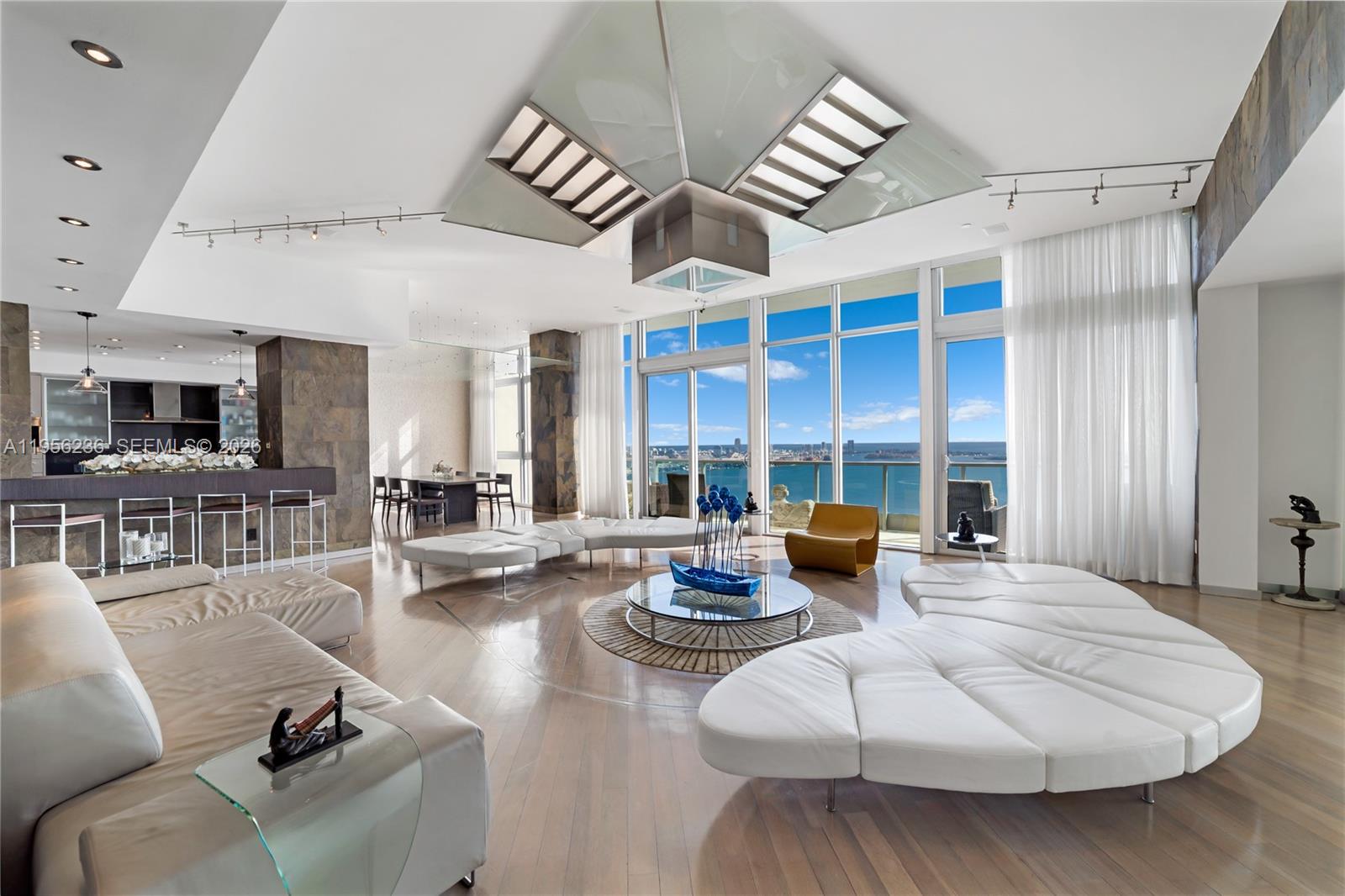 Unobstructed Miami skyline vistas await in this stunning, sprawling residence, where dramatic floor-to-ceiling windows frame breathtaking views from nearly every space. Previously owned by legendary Luis Miguel, the home boasts an expansive main living area featuring a dedicated bar and seamless flow, while the oversized primary suite offers a private lounge, direct balcony access, a walk-in closet, and a spa-like bath. Ideally located in the heart of Brickell, you’re only moments from Brickell City Centre, neighborhood markets, and acclaimed dining including Osaka and LPM, with the waterfront path and scenic Brickell Key just outside your door. Resort-style amenities include a pool, locker rooms with a sauna and steam room, a state-of-the-art fitness center rivaling private clubs, and a full-floor work center, all within a pet-friendly building known for exceptional staff - The Jade delivers the very best of luxury urban living in one of Miami’s most vibrant neighborhoods.
