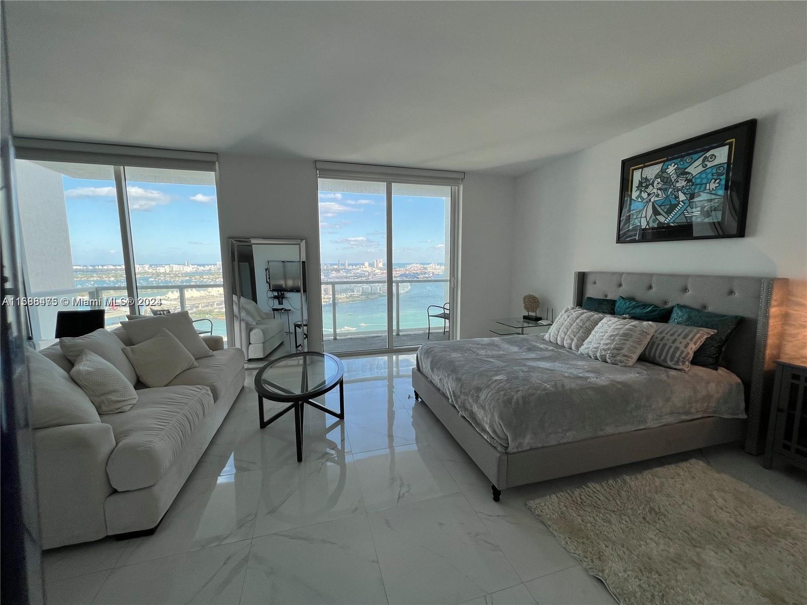Fully Furnished  studio in the prestigious Vizcayne building offers a luxurious living experience with mesmerizing bay views. As you step into this modern retreat, you're greeted by an elegantly designed space that maximizes both comfort and style. Vizcayne offers a range of luxurious amenities to enhance your lifestyle. Indulge in relaxation at the resort-style pool, unwind in the sauna, or stay active in the state-of-the-art fitness center. A business center and conference rooms are available for those who work remotely or require professional spaces. The building's prime location allows you to experience the best of Miami's cultural scene, dining, and entertainment. Just steps away from the vibrant Bayside Marketplace. Assigned parking.