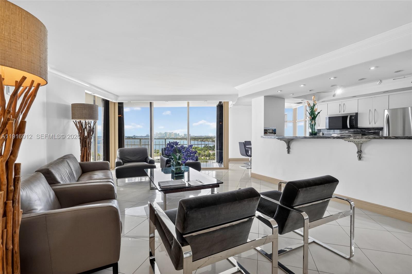 Stunning, fully remodeled corner-unit located within the serene Biscayne Park neighborhood, nestled on an expansive 33-acre property. This unit offers breathtaking, unobstructed water views from every room and sits on the most coveted line in the building. Inside, the residence features elegant porcelain floors, brand new appliances, a modern open layout, and the convenience of an in-unit washer and dryer. With 2 bedrooms and 2 bathrooms, this home blends style and comfort effortlessly. Residents enjoy an impressive collection of luxury amenities including a state-of-the-art fitness center and spa, indoor and outdoor heated pools, lap pool, sauna and steam rooms, 8 tennis and pickleball courts, racquetball and basketball courts, scenic walking paths, and beautifully landscaped gardens with waterfalls throughout the property. Quayside also features a private marina with bay access, waterfront promenade, on-site restaurants and café, playground, dog park, BBQ areas, valet service, and 24-hour gated security with roaming patrol and concierge-style services Boat slips available based on availability, at very attractive prices. A rare opportunity at unbeatable price!