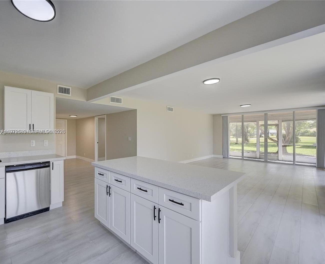 1st Floor – Fully Updated 3BR/2BA Corner Unit with Golf Course View

Beautifully updated and spacious first-floor corner condo featuring an open layout filled with natural light and serene golf course views. This move-in-ready unit offers waterproof flooring throughout, modern baseboards, and a fully renovated kitchen with white shaker-style cabinets, new hardware, stainless steel appliances, slide-in range, quartz countertops, center island, and a stunning designer backsplash that adds a luxurious touch. The primary suite includes a walk-in closet, and both bathrooms are upgraded with porcelain tile, quartz vanities, new fixtures, and frameless glass shower in the guest bath. Major upgrades include newer A/C, newer water heater, new washer & dryer, and new bath fixtures. The screened-in patio is expansive and completely redone with anti-slip flooring throughout, providing safety and comfort. All patio screens have been upgraded to Pet Screen for extra durability — resistant to scratching and ideal for pet owners. Roll-down shutters throughout add additional protection and privacy. Additional features include a storage room, dedicated parking space plus ample guest parking. Maintenance includes roof repairs, insurance, water, cable, and more. Centrally located near I-75, Sawgrass, shopping, dining, and entertainment.