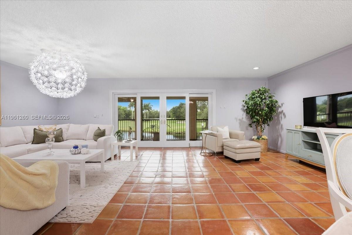 Rare legally combined corner residence in the gated Lago Mar community, offering 4 bedrooms, 3 bathrooms, and approximately 2,593 sq ft of living space with lake and golf-course views. This spacious home features an open living and dining layout, a large balcony, impact glass, in-unit laundry, generous storage, and a flexible office, den, or sitting area off the primary suite. The oversized primary retreat includes a walk-in closet and spacious bath, while the split layout offers comfort for family, guests, or work-from-home needs. Conveniently located near American Heritage School, Sawgrass Mills, dining, and major highways. A rare opportunity to own one of the larger residences in this desirable gated Plantation community.
