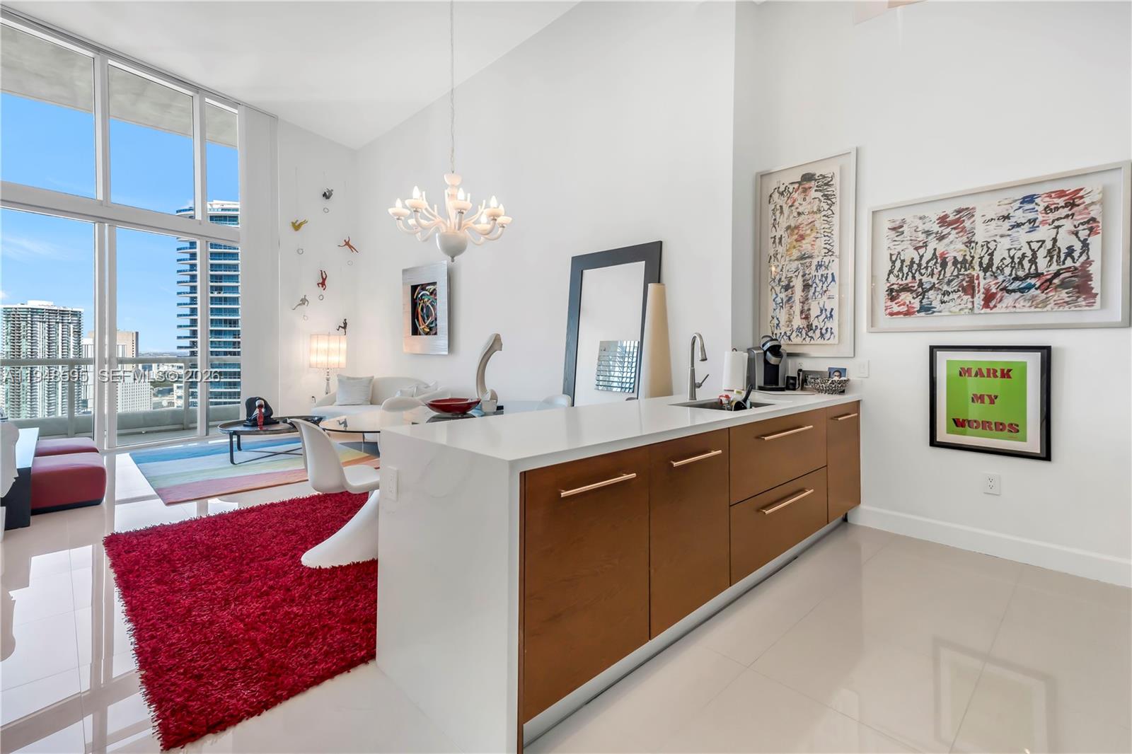 Only available unit in the building with 16 ft. "Double Height Ceilings" on a high floor!  Waterfront, along the Miami River, with views of Biscayne Bay and the Atlantic in the backdrop.  Pristine condition, never rented, and with updated kitchen countertops and a large, oversized balcony stretching the entire wide of the condo.  Enjoy the best amenity package in Brickell, including Miami's largest Rooftop Pool, 5-Star Spa, Waterfront Gym, and multiple restaurants on-site, including Miami's only Cipriani.