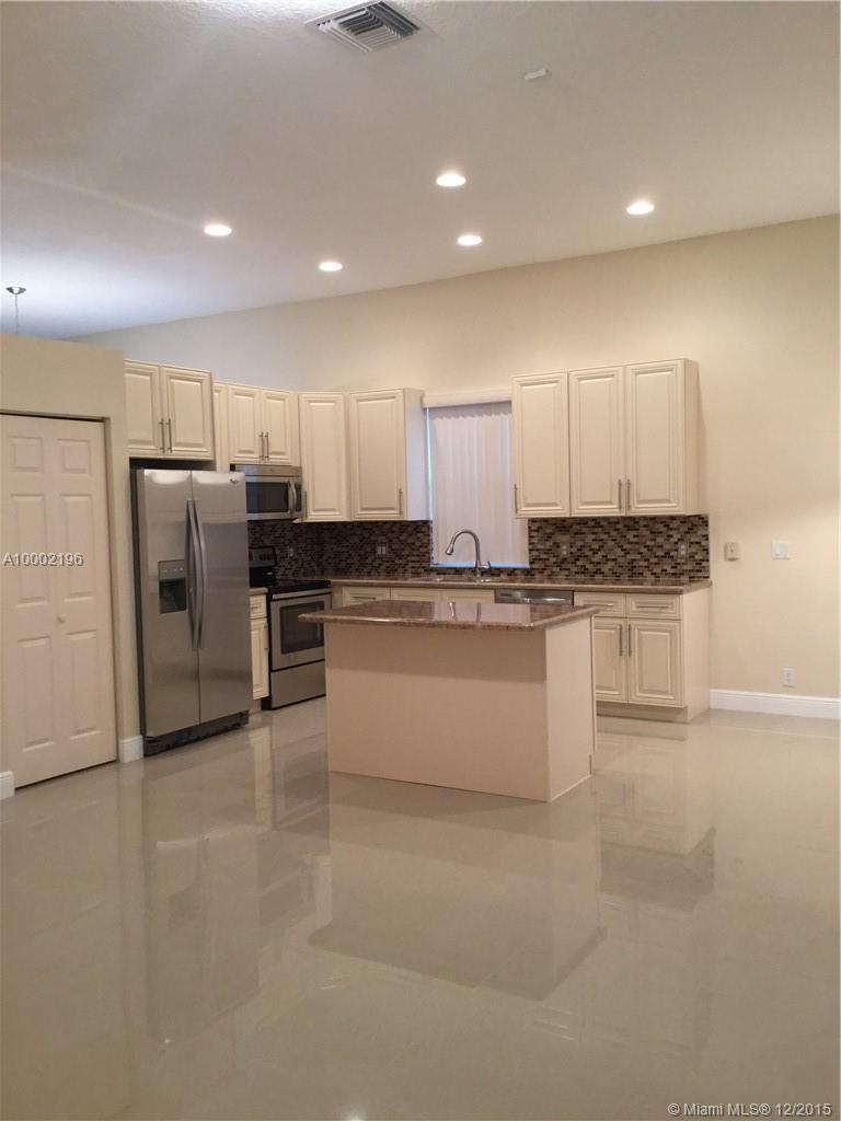 Must see! Remodeled/upgraded 1-story 3/2.5 with 2-CG located on a corner lot, in Heritage at Pembroke Falls community. Fenced yard with fruit trees, accordion storm shutters; split floor plan with open concept kitchen, separate liv/din/fam/laundry rooms, roman tub & shower in mbath, large WI closet in mbedrm & security alarm system. New porcelain tile & laminate floors throughout; completely new kitchen & bathrooms with granite counter tops, SS appliances & more; and all new light fixtures.