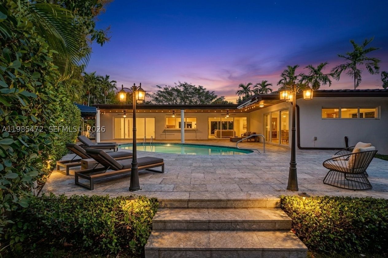 NEW PRICE! Just appraised in March 2026 for more than the asking price!! Instant equity the day of closing!! A truly rare offering in one of the most coveted pockets of North Miami Shores—this exceptional residence has been tightly held for over three decades & is now available for the most discerning buyer! Thoughtfully reimagined with a refined eye for design and livability, the home spans over 3,200 total SFT, offering four bedrooms and three impeccably appointed bathrooms. A seamless, open-concept layout anchors the residence, centered around an Italian-inspired chef’s kitchen featuring bespoke cabinetry, a generous island, pristine white quartz surfaces, top-tier appliances, and a gas range. Overlooking the living spaces, a resort-style Diamond Brite pool is framed by lush, mature landscaping, creating a private sanctuary / Zen-like ambiance. A covered patio and gazebo set the stage for sophisticated gatherings. A split-bedroom floor plan with soaring ceilings and recessed lighting elevate the home’s airy, modern aesthetic. Extensive capital improvements—exceeding $250,000—offer peace of mind and effortless ownership, including a newer roof (2015), plumbing (2018), electrical panel (2017), central A/C (2019), & pool with equipment (2022). Additional mini-split systems (2025) provide tailored climate control throughout. The property is further enhanced by full impact windows & doors, a spacious circular driveway, & a one-car garage or possible 5th BR, office, or studio.