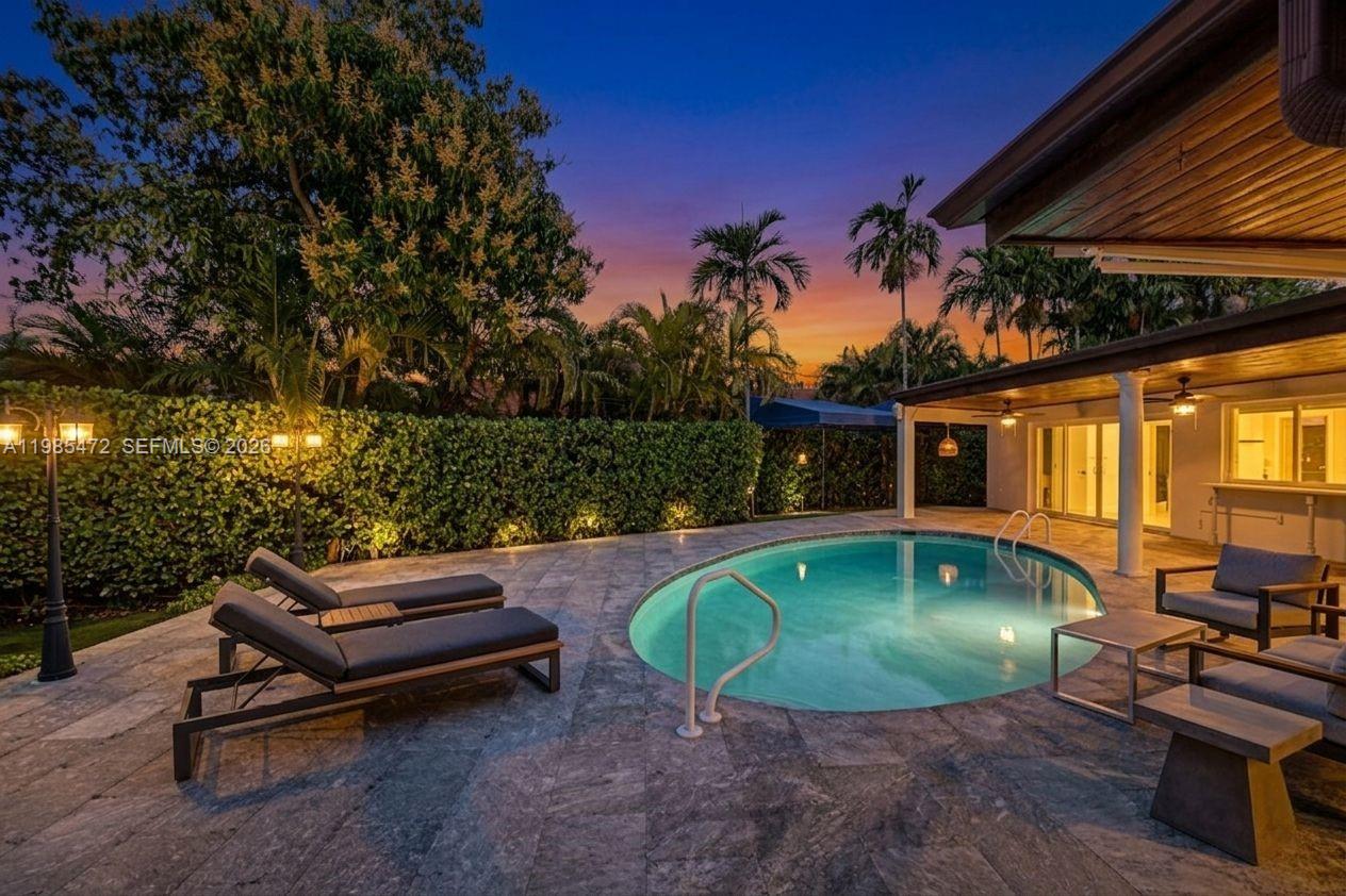 NEW PRICE! Just appraised in March 2026 for more than the asking price!! Instant equity the day of closing!! A truly rare offering in one of the most coveted pockets of North Miami Shores—this exceptional residence has been tightly held for over three decades & is now available for the most discerning buyer! Thoughtfully reimagined with a refined eye for design and livability, the home spans over 3,200 total SFT, offering four bedrooms and three impeccably appointed bathrooms. A seamless, open-concept layout anchors the residence, centered around an Italian-inspired chef’s kitchen featuring bespoke cabinetry, a generous island, pristine white quartz surfaces, top-tier appliances, and a gas range. Overlooking the living spaces, a resort-style Diamond Brite pool is framed by lush, mature landscaping, creating a private sanctuary / Zen-like ambiance. A covered patio and gazebo set the stage for sophisticated gatherings. A split-bedroom floor plan with soaring ceilings and recessed lighting elevate the home’s airy, modern aesthetic. Extensive capital improvements—exceeding $250,000—offer peace of mind and effortless ownership, including a newer roof (2015), plumbing (2018), electrical panel (2017), central A/C (2019), & pool with equipment (2022). Additional mini-split systems (2025) provide tailored climate control throughout. The property is further enhanced by full impact windows & doors, a spacious circular driveway, & a one-car garage or possible 5th BR, office, or studio.