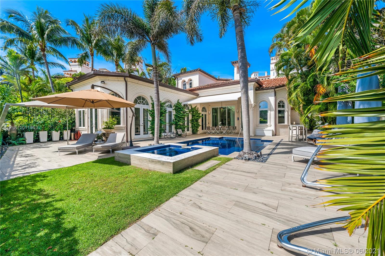 This one of a kind two story fully renovated two story gem at Valencia Estate greets you with high ceilings, private pool and expansive terraces overlooking the Fisher Island golf course. It showcases: 4 bedrooms + office+ family room, 5.5 bathrooms,  marble floors throughout, a 2000 bottles wine cellar, a state of the art kitchen with top of the line appliances, impact glass doors, stair left, 3 cars/1 golf cart covered parking garage w/attic, smart house system, pool/jacuzzi w/awning on the terrace and outside shower and built in BBQ. Live the Fisher Island living in this exceptional masterpiece!