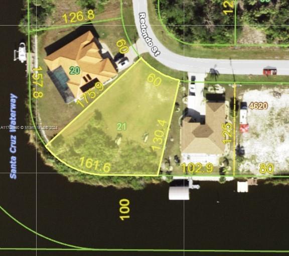 Oversized Deep Water Lot with No Bridges to the Lock.  Over 160 Feet of waterfront on the main Santa Cruz Waterway which is approximately 100' wide.    
South Western Views facing the Canal.  
This is one of the last remaining South Western Corner Deep Waterfront Sailboat Lots remaining in South Gulf Cove on the main Santa Cruz Waterway.   
Lot Dimensions are 60' along the road, 175.9 and 130.4 from the road to the waterfront, and 161.6 waterfront on the main canal which is approximately 100' wide.