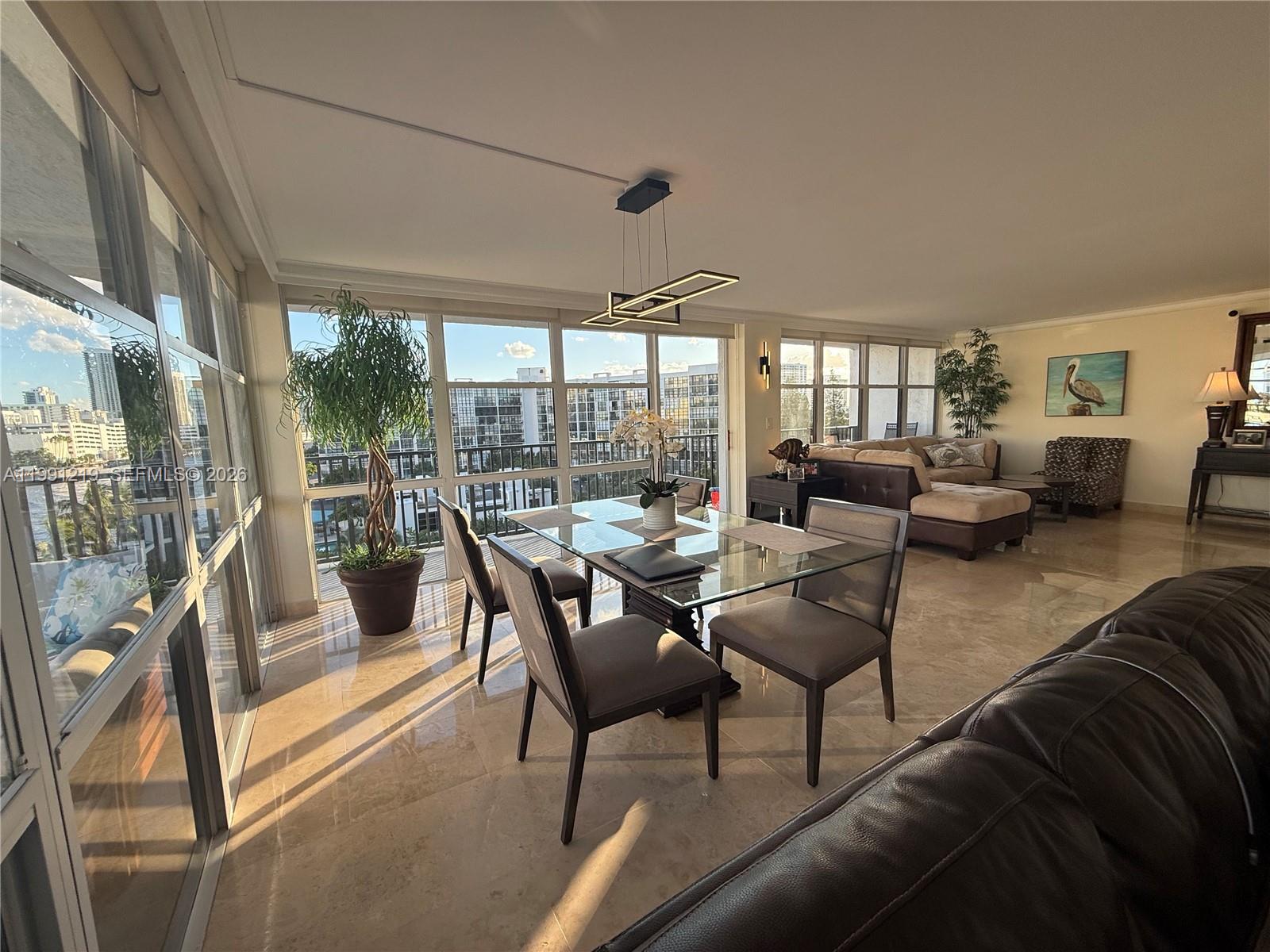 2 bedroom and 2 bathroom with a spacious DEN, 1430 sq ft of living area, the perfect condo for everyday living or rent right away after the purchase.Open layout and abundance of natural light due to its corner location and floor to ceiling windows.Step outside onto the wrap-around balcony and enjoy peaceful views of the Intracoastal and ocean breezes. It’s the perfect spot to start your morning with coffee or unwind at the end of the day.Amenities: tennis,pickleball,sauna,pool,gum,clubhouse, attended lobby and more. HOA includes all utilities - you only pay electric. Newer AC and perfectly maintained unit. NO laundry in unit. Each floor has shared common laundry facility. Walking distance to the ocean, shopping , parks and more.