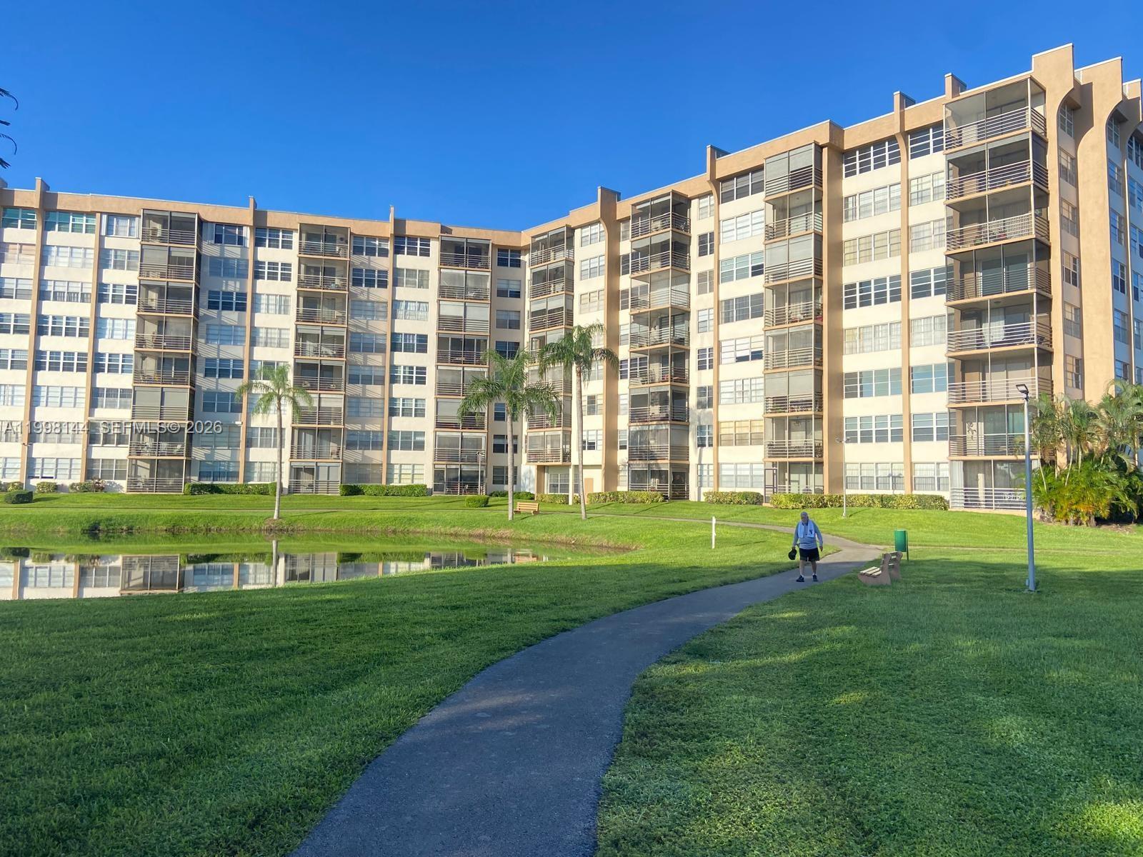 **(55+ Community)** Beautiful 2-bedroom, 2-bath unit in excellent condition, featuring lake and golf course views. Renovated bathrooms, laminate flooring, and a kitchen with stainless steel appliances—spacious layout with a screened-in balcony and abundant natural light. The community offers 24-hour security, heated pools, tennis courts, walking trails, and a clubhouse. Prime location near Pembroke Lakes Mall, restaurants, hospitals, and major highways (I-75, Turnpike, Pines Blvd). Easy to show.