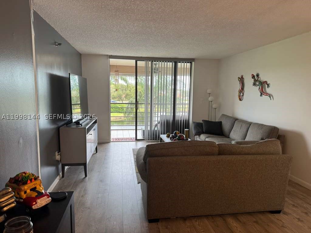 **(55+ Community)** Beautiful 2-bedroom, 2-bath unit in excellent condition, featuring lake and golf course views. Renovated bathrooms, laminate flooring, and a kitchen with stainless steel appliances—spacious layout with a screened-in balcony and abundant natural light. The community offers 24-hour security, heated pools, tennis courts, walking trails, and a clubhouse. Prime location near Pembroke Lakes Mall, restaurants, hospitals, and major highways (I-75, Turnpike, Pines Blvd). Easy to show.