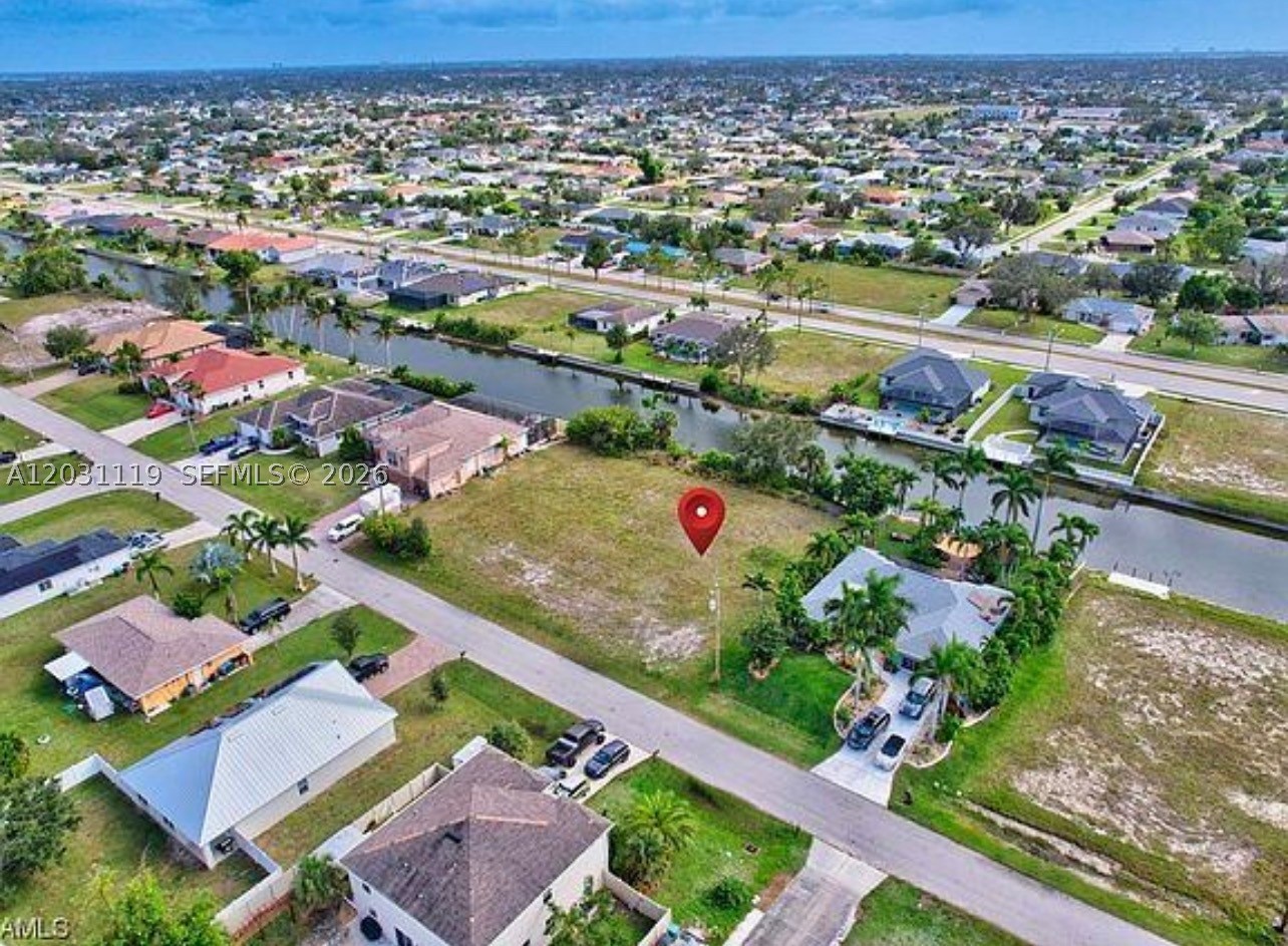 An excellent opportunity to acquire a residential lot with beautiful canal views in one of Cape Coral's fastest-growing areas. This property offers the ideal space to build your dream home or make a long-term investment in Southwest Florida’s dynamic real estate market. Enjoy the tranquility and beauty provided by the canal view. Located in an area of constant development, this lot combines a prime location, appreciation potential, and an attractive canal-front setting. Don't miss this chance to invest in a waterfront-view property in one of Florida's most desirable communities. Jet skis, Kayaks allowed. Buyer to verify utility availability and connection status.