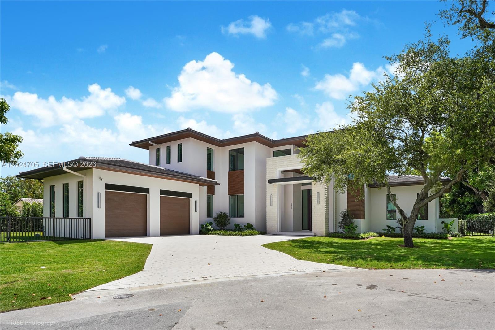 Tucked away at the end of a quiet cul-de-sac in the exclusive Coconut Palm Estates in North Pinecrest, this brand-new 6br/5.5ba, 6,806 total sq ft custom home by the renowned Pacheco Architecture team, features cabinetry and design by Italkraft, offering bespoke luxury with designer finishes.

The smart home features a private elevator, two laundry rooms (upstairs/downstairs), and a spa-style steam room. The chef’s kitchen includes a butler’s pantry with premium Sub Zero/Wolf appliances. Outdoor living shines with a fully equipped, expansive outdoor kitchen featuring bar seating, dishwasher, ice maker, and more. The 40-foot saltwater pool system with separate jacuzzi and outdoor shower adds to the oasis.

The primary suite boasts an expansive his/hers walk in closet as well as a private morning bar with a refrigerator. Walk-in closets by Italkraft throughout the home

Additional features:  Energy-efficient low-emission windows, 4 AC units w/ smart thermostats, electric vehicle charger, generator ready, solar panel ready, Duravit smart toilets, 4K integrated security camera system, hardwired Cat6 network, epoxy garage, well water sprinkler system, indoor/outdoor speaker sound system