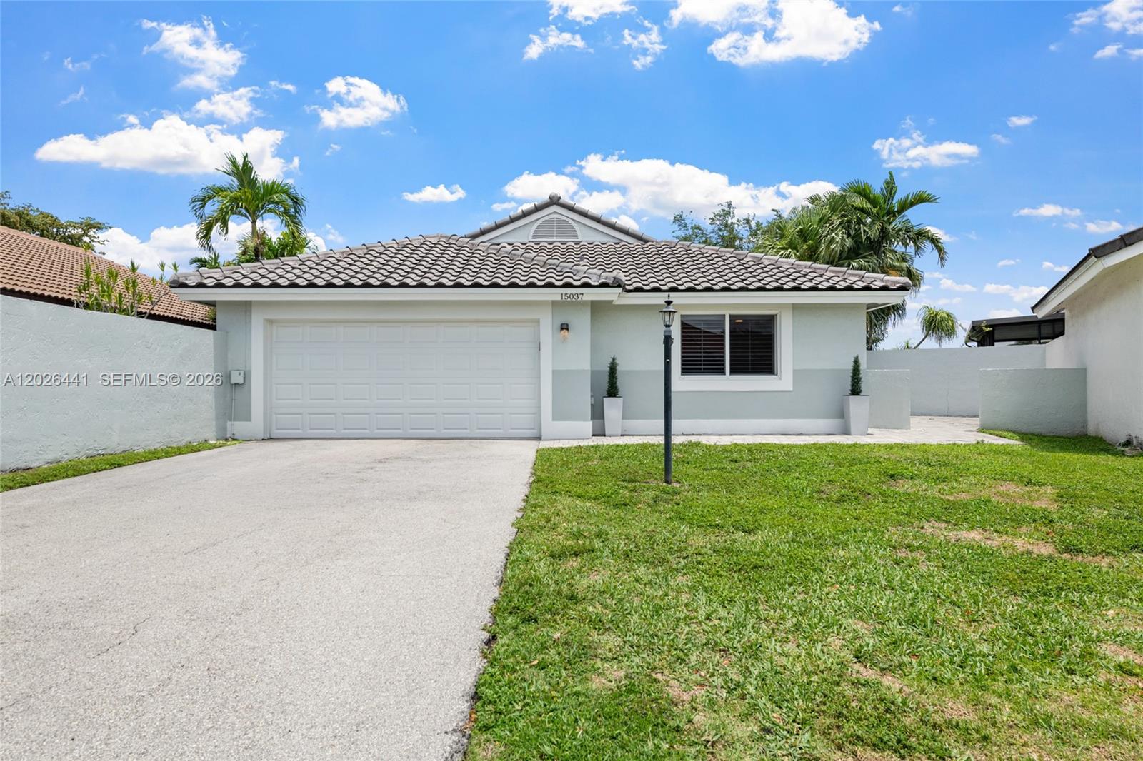 BEAUTIFULLY COMPLETELY UPDATED 3 BEDROOM, 2 BATH LAKEFRONT HOME WITH A BRAND NEW ROOF IN THE DESIRABLE WATERFORD OF IVANHOE IN DAVIE! Enjoy gorgeous lake views, lush landscaping, vaulted ceilings, tile flooring, custom accents, and an open, light-filled layout. Renovations completed include the kitchen, bathrooms, flooring throughout, impact windows and doors, impact garage door, electrical panel, lighting, and all appliances. New A/C installed in 2022 and BRAND NEW ROOF in 2023! Relax or entertain on the brick paver patio overlooking the serene lake. Waterford offers a community pool and is conveniently located near parks, shopping, dining, top-rated A+ schools, and major highways. Rare opportunity in a neighborhood with very few homes currently available!