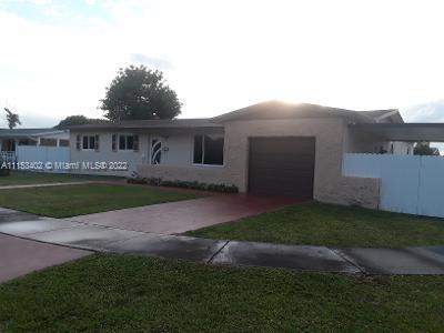 This 4 bedroom 2 bath home with impact windows, an office alcove, a family room and a garage on a large corner lot is waiting for a large family! As you enter the foyer, you'll notice that the home is cozy, yet spacious.... and great for entertaining!  Bedrooms are on a split plan.There is ample parking for guests in the driveway, and on the street. The large yard has a side fenced opening for cars, as well. There is a side, covered patio, an above ground pool, a hot tub and ample yard space for fruit trees and a garden! A must see! Sold As-Is.