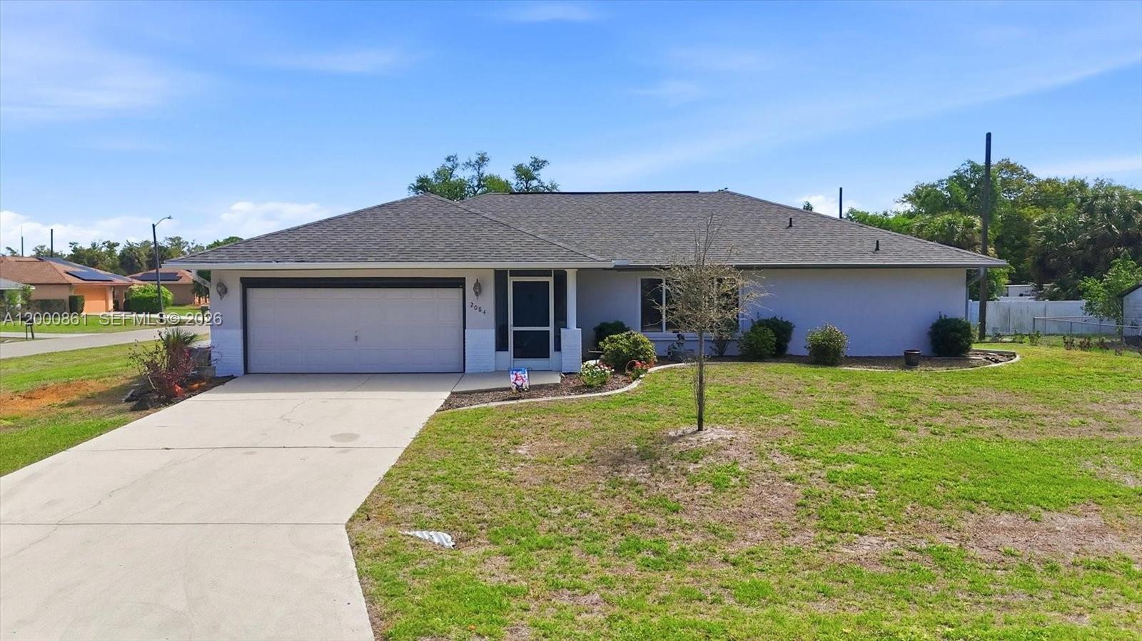 Welcome to 2084 Leisure Street in Port Charlotte — a well-maintained home with important updates already in place. Recent improvements include a new roof in 2021, new A/C in 2022, and fresh exterior paint in 2026, giving buyers added confidence and a clean, updated first impression.Garage features a pull down screen, so you can work in the garage without bugs! Situated on an extra large lot, this property offers added space to enjoy outdoor living, gardening, storage, or simply a little more room to spread out. Conveniently located close to shopping, medical facilities, parks, schools, and a boat launch, this home offers both comfort and accessibility. Whether you are looking for a full-time residence, seasonal retreat, or investment opportunity, this Port Charlotte property is a great option with key updates already taken care of.