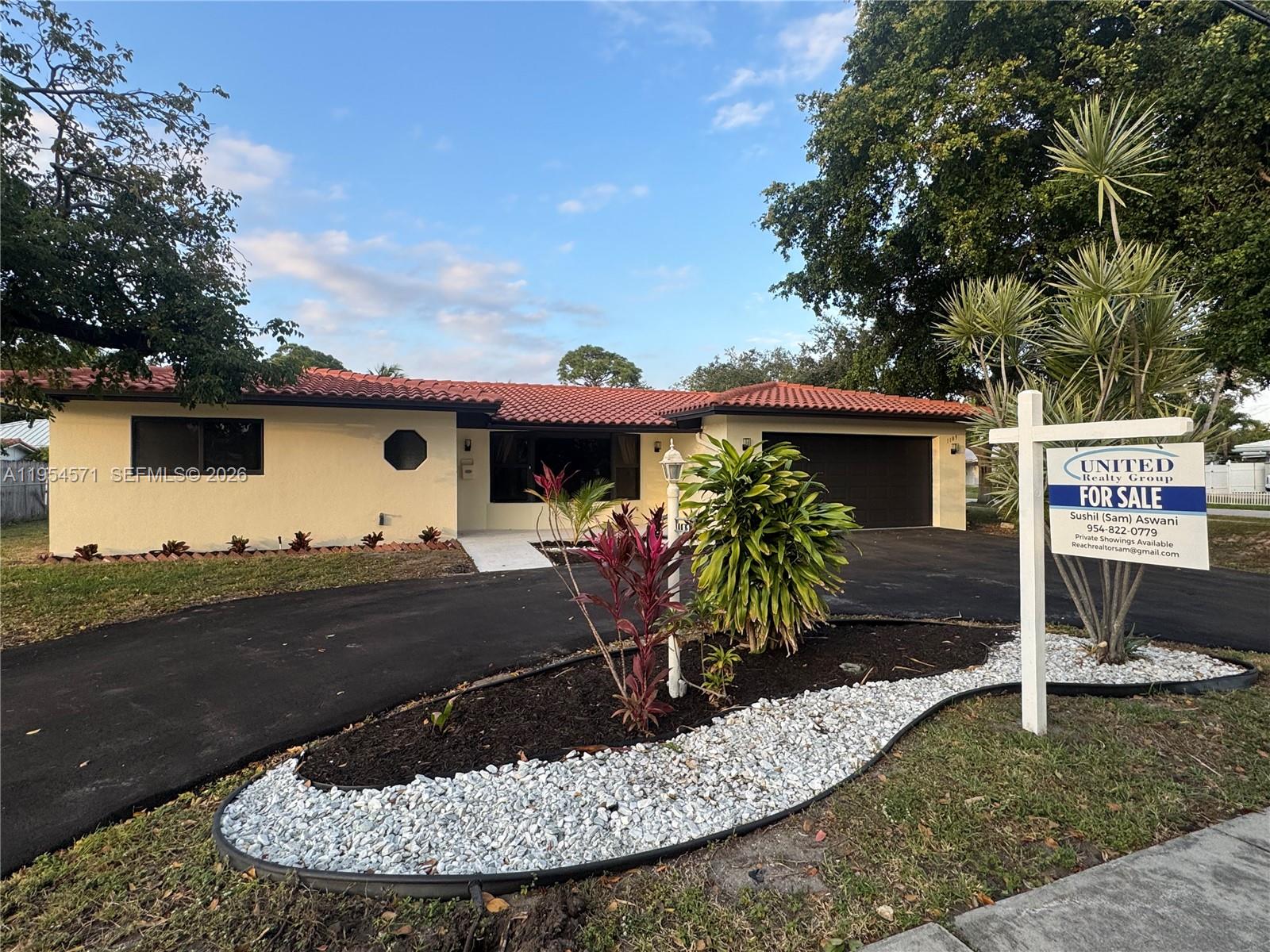 One or more photo(s) was virtually staged. Welcome to this beautifully updated 2-bedroom, 2-bathroom home with a 2-car garage and circular driveway, located in the highly desirable Cove neighborhood of Deerfield Beach. Situated on an oversized corner lot, this home is just a short distance to The Cove Shopping Center, marina, sand, ocean, restaurants, and shops.
 
The home features all hurricane impact windows and doors, 2018 roof, freshly painted interior and exterior, tile floors in living and dining areas, and laminate flooring in the bedrooms. Updated kitchen with Corian countertops and remodeled bathrooms with upgraded finishes make this home move-in ready.
Prime corner-lot location, minutes from the beach—ideal for investors or short-term rentals with No HOA.