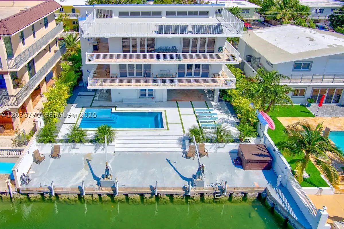 Welcome to 177 Lorelane Place, a tropical waterfront retreat in the heart of Key Largo. Situated on a protected canal with direct ocean access, this exceptional property offers quick and easy access to the Atlantic, making it a dream for boaters, anglers, and water lovers alike.

Designed for comfort and flexibility, the home features kitchens and washer/dryer facilities on every floor, making it ideal for extended families, guests, or multi-generational living. Each level provides convenience and privacy while maintaining a warm, inviting atmosphere.

Step outside to your own oasis, highlighted by a sparkling swimming pool surrounded by lush tropical landscaping. Whether entertaining friends, enjoying a quiet afternoon, or cooling off after a day on the water, the outdoor space is designed for relaxation and enjoyment.

Mature fruit trees add beauty, shade, and fresh seasonal harvests, enhancing the authentic Florida Keys lifestyle. With direct ocean access, resort-style outdoor living, and versatile accommodations, 177 Lorelane Place offers the perfect blend of comfort, convenience, and island charm.