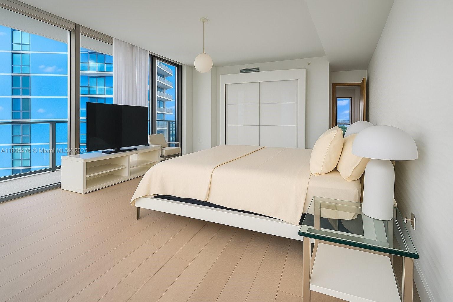 Residence Features
• Custom re-imagined floor plan originally conceived as a three-bedroom residence and redesigned during pre-construction to create a dramatic 15' x 25' primary suite, second bedroom, and open private den • Nearly 900 sq ft wraparound terrace with sweeping bay, skyline, and ocean vistas—ideal for indoor-outdoor living • Sleek European appliance package paired with high-end designer finishes throughout • Electric window shades and striking three-dimensional feature walls • Private elevator entry opening to a refined, gallery-style foyer • Oversized laundry room with full-size washer/dryer, 
utility sink, and additional storage The open den is perfectly suited for a home office, library, or media lounge and is conveniently located adjacent to a full bath, offering exceptional flexibility without functioning as a third bedroom. Set in the heart of Edgewater’s coveted waterfront corridor, this turnkey residence offers unmatched views, thoughtful customization, and elevated livability—ideal for buyers seeking space, design, and sophistication beyond the standard condominium layout.
Furniture negotiable.
Showing Monday to Thursday from 12-2pm