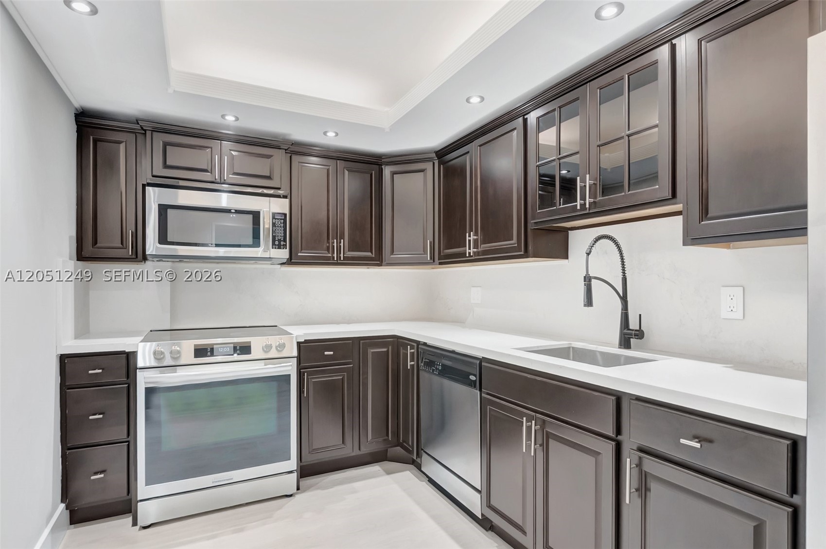 Large 1 bed, 1 and a half bath condo across from the beach. Beautifully renovated kitchen and baths. Lots of closet space, including a storage locker on the first floor for your beach chairs, etc. Unit has impact windows and a covered parking space. Lobby has security guard until 11 p.m. 7 days a week. There is a gym, recreation room, pool and BBQ area as well. 75 inch TV in the living room can stay. Basic cable and internet, water and electricity for AC are included. Walking distance to JB's on the beach and many other restaurants and shops..
