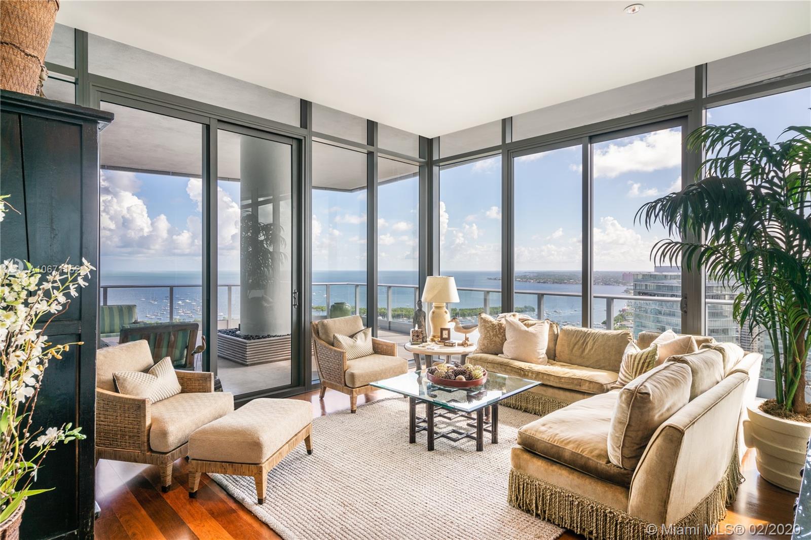 Elegant 2 story 7,061 sq ft Penthouse with expansive 5,216 total sq ft terraces and soaring ceilings - providing unrivaled panoramic views of Marinas, Biscayne Bay and the City. Private elevator foyer and grand Nautilus shaped stairs introduce rare private Roof Top Terrace complete with barbecue area and full air conditioned bar area. Designed by architect Jenifer Briley. Master Suite is complimented by 2 sitting rooms, double dressing area and massive bath. Gourmet kitchen includes European appliances, oversized island and multiple dining areas. This luxurious 4 bed, 3 full and 2 half baths Penthouse boasts additional library, den, formal living room and family room. 4 parking spaces included in sale. Located in the best full-service building in Coconut Grove – Grovenor House.