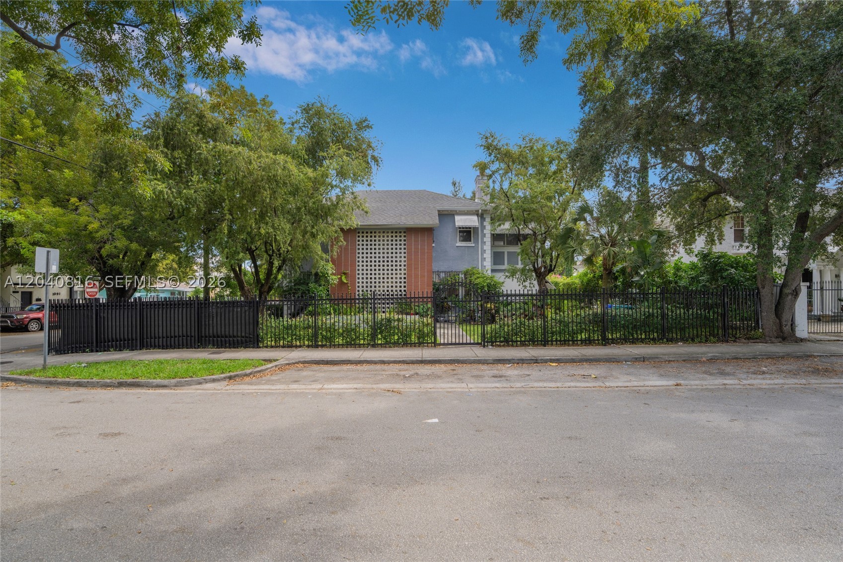This is a unique property, once the home of Miami's pioneering Milam family, legally converted to two large units with great period details and updated electric and plumbing, central AC, separate meters. Zoning allows for expansion. Detached two car garage with attached efficiency could be another unit. Great for someone who wants to live in and have no mortgage payments or developers who would redevelop this large corner property in the very heart of Miami, owner financing with adequate down payment.
