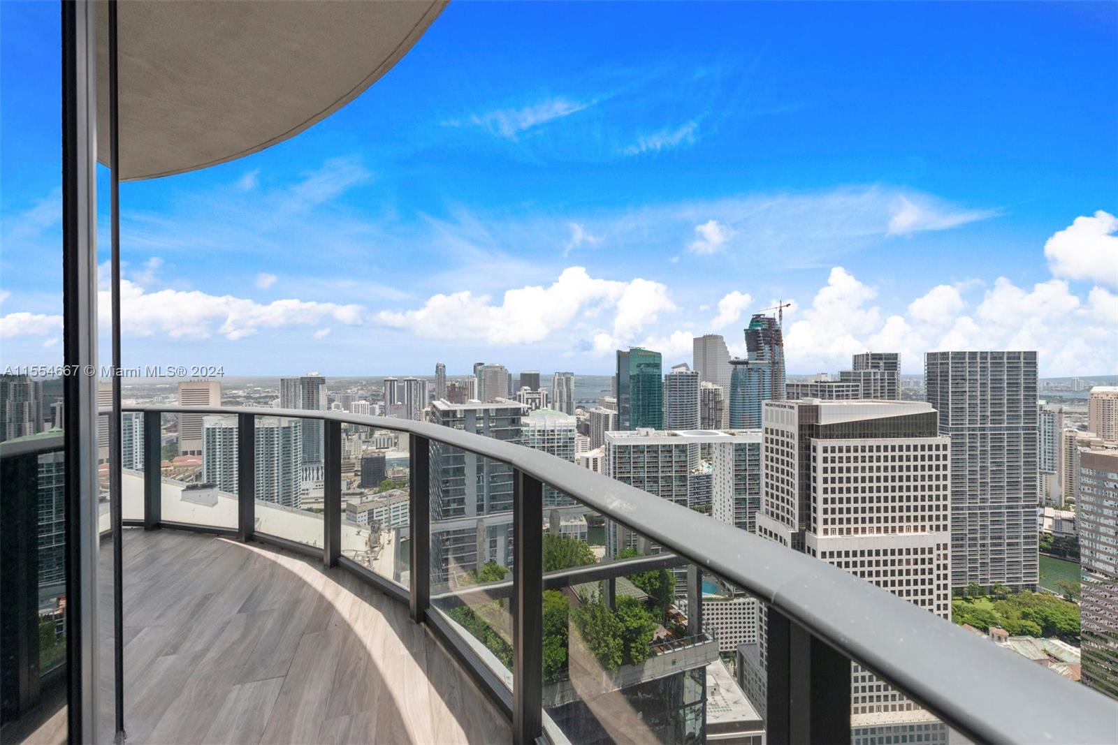 Super high 54th floor corner unit 2/2. Panoramic water and city views from every room. Private elevator. Marble baths and high end appliances. Enoy amenities designed by Phillip Starck: spa, gym, 200" pool, private cabanas, kids, party and billiard room. Smart building technology, window treatments.