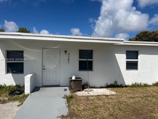 This elegantly renovated single-family home sits on a spacious lot, ideal for a growing family. It boasts expansive white porcelain tiles, a freshly updated kitchen with new cabinets and countertops, and soaring ceilings. The home is equipped with a new roof, and features hurricane impact windows. A generous backyard, adorned with mature fruit trees, offers ample space for gatherings. Its proximity to downtown Fort Lauderdale's entertainment, dining, transport, and job opportunities adds to its appeal. House includes a laundry room at the back of the property with washer/dryer hookups. No association approval required. Great for investment or living. Easy to show