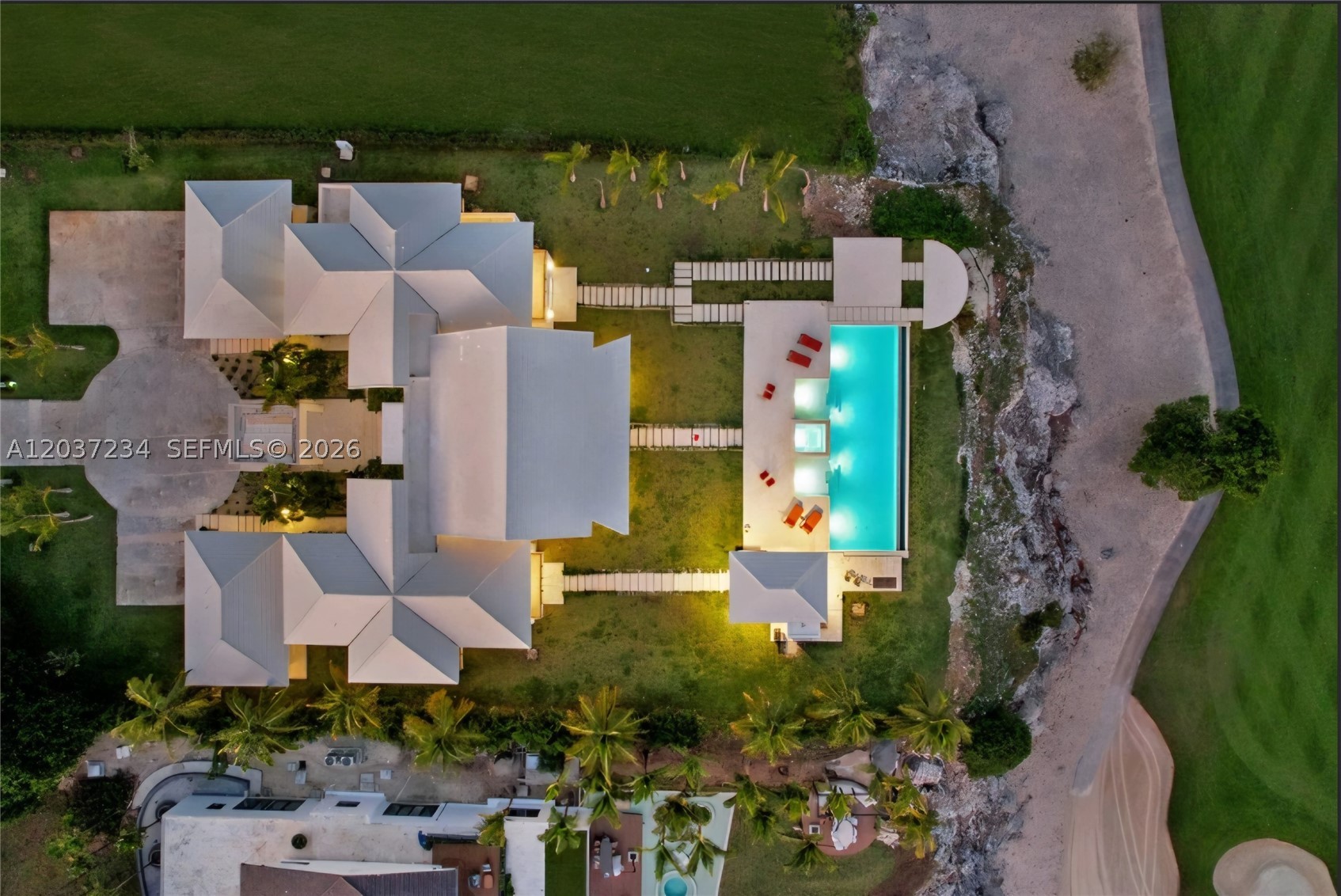 Nestled amidst the lush greenery of Cap Cana, this magnificent villa offers the perfect blend of elegance and tropical charm. Step inside and be greeted by an expansive living space that seamlessly blends indoor and outdoor living. Relax by the infinity pool, soak in the Jacuzzi, or unwind in the palapa while enjoying the gentle Caribbean breeze.

Plot of 7,000 square meters with ample space for privacy and relaxation 
? 2,500 square meters of construction area, including a spacious house, expansive decks, terraces, and a palapa 
? 7 bedrooms and 7.5 bathrooms, all beautifully appointed with high-end finishes 
? Two master suites, each with a private balcony and walk-in closet 
? Fully equipped kitchens, perfect for preparing gourmet meals 
? Outdoor living area with a BBQ grill, palapa, and bathroom 
? Private swimming pool and Jacuzzi for endless hours of fun 
? Helipad for convenient arrivals and departures 
? Separate house for staff with laundry, storage, and private quarters 
? Fully furnished with exquisite taste and attention to detail.